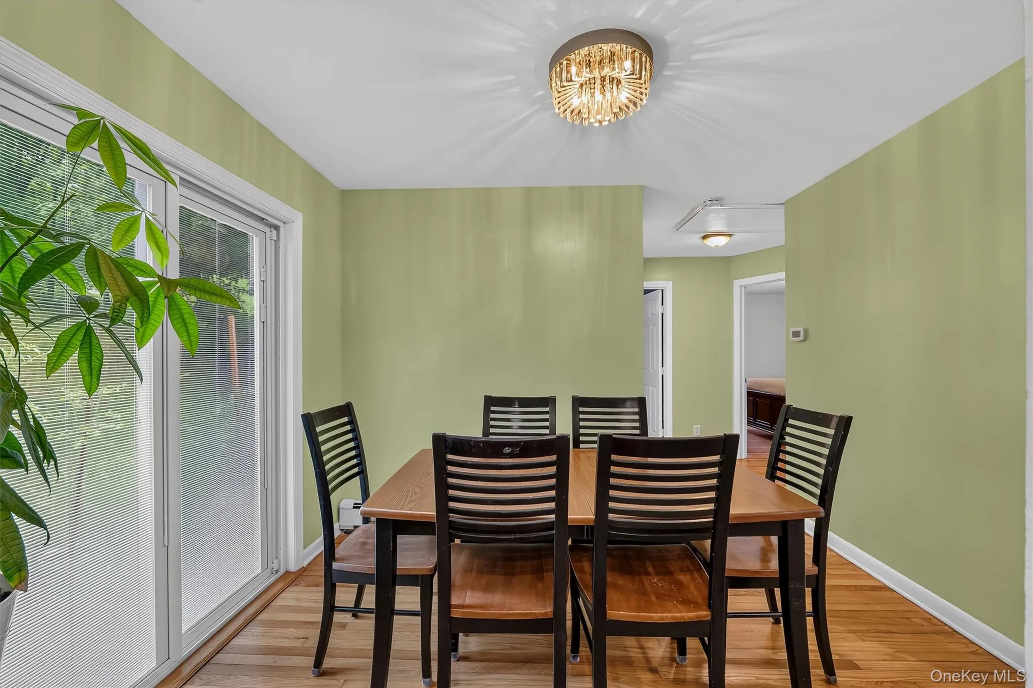 Dining room provides a welcoming gathering space with a view toward the hallway leading to the bedrooms. Dining room provides a welcoming gathering space with a view toward the hallway leading to the bedrooms.