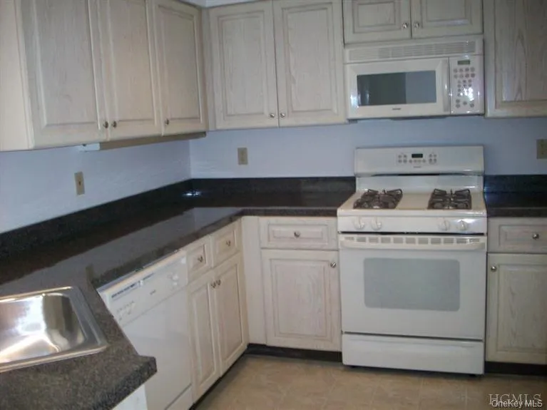 Kitchen with gas stove, dishwasher, and plenty of storage space. Kitchen with gas stove, dishwasher, and plenty of storage space.