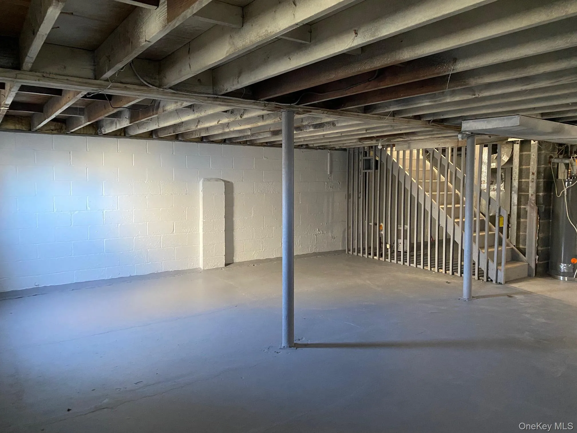 Full, unfinished basement with egress window. Full, unfinished basement with egress window.