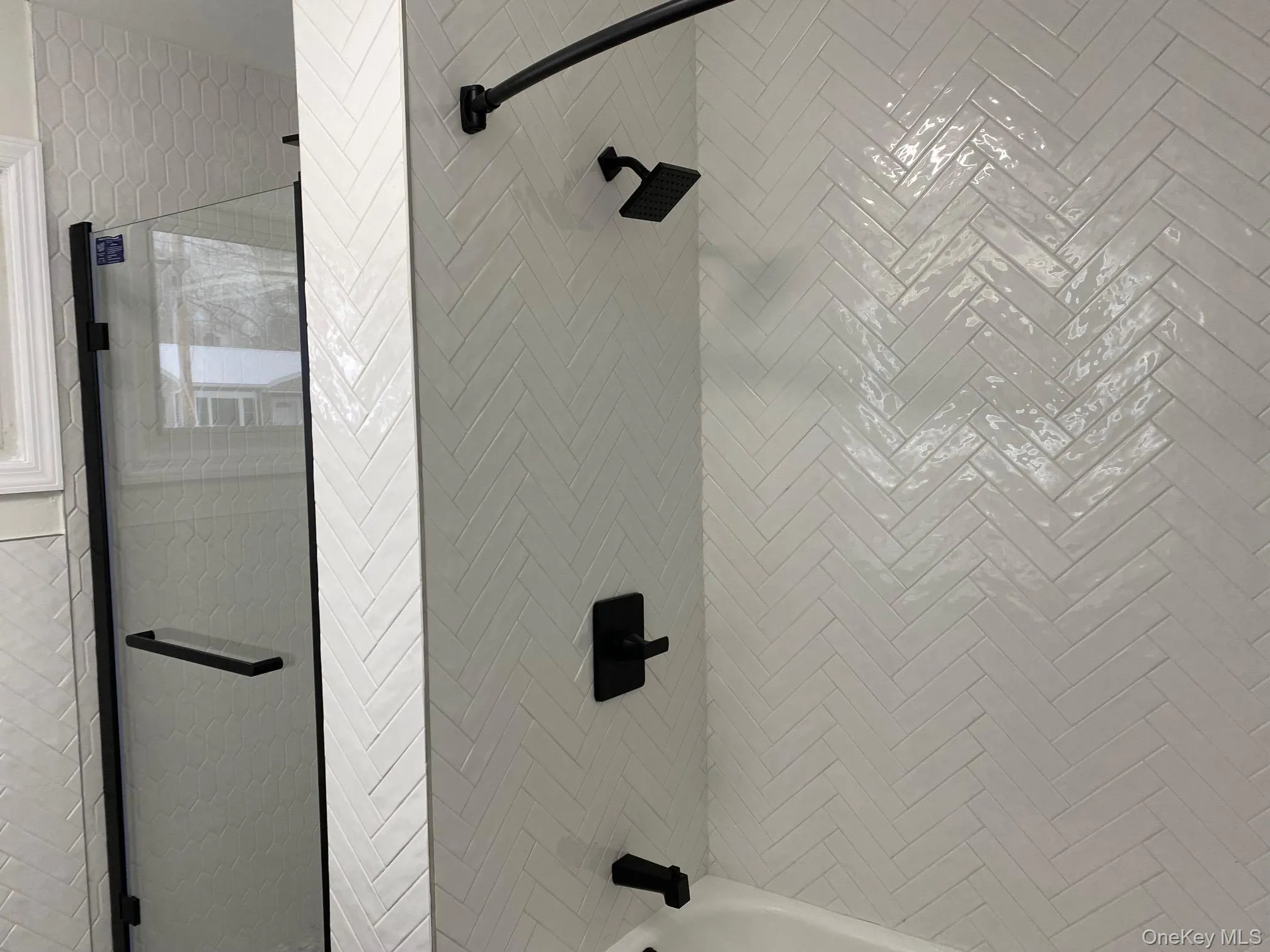 Bathroom with bath / shower combo with glass door Bathroom with bath / shower combo with glass door