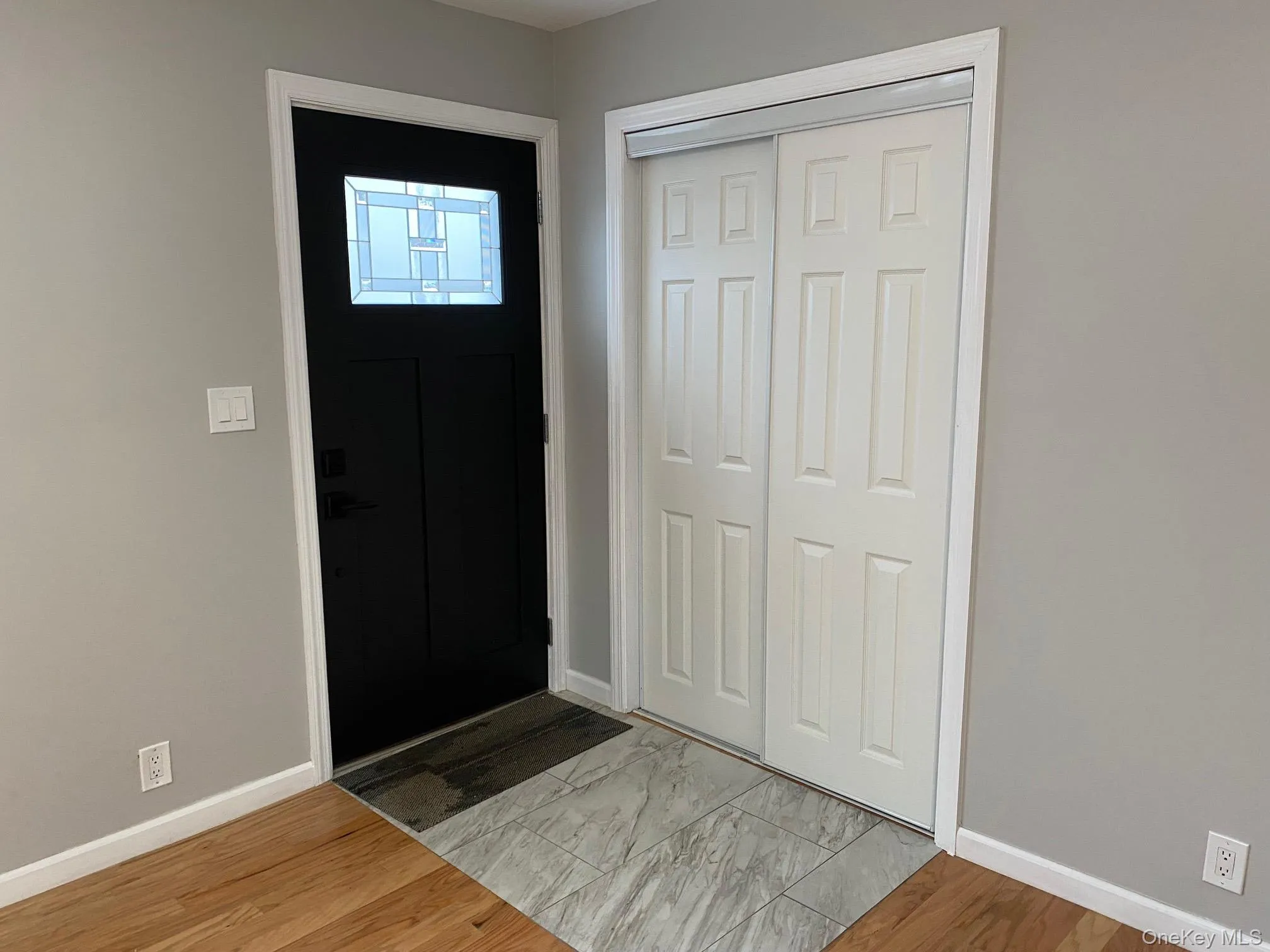 Entrance foyer featuring light wood finished floors and baseboards Entrance foyer featuring light wood finished floors and baseboards