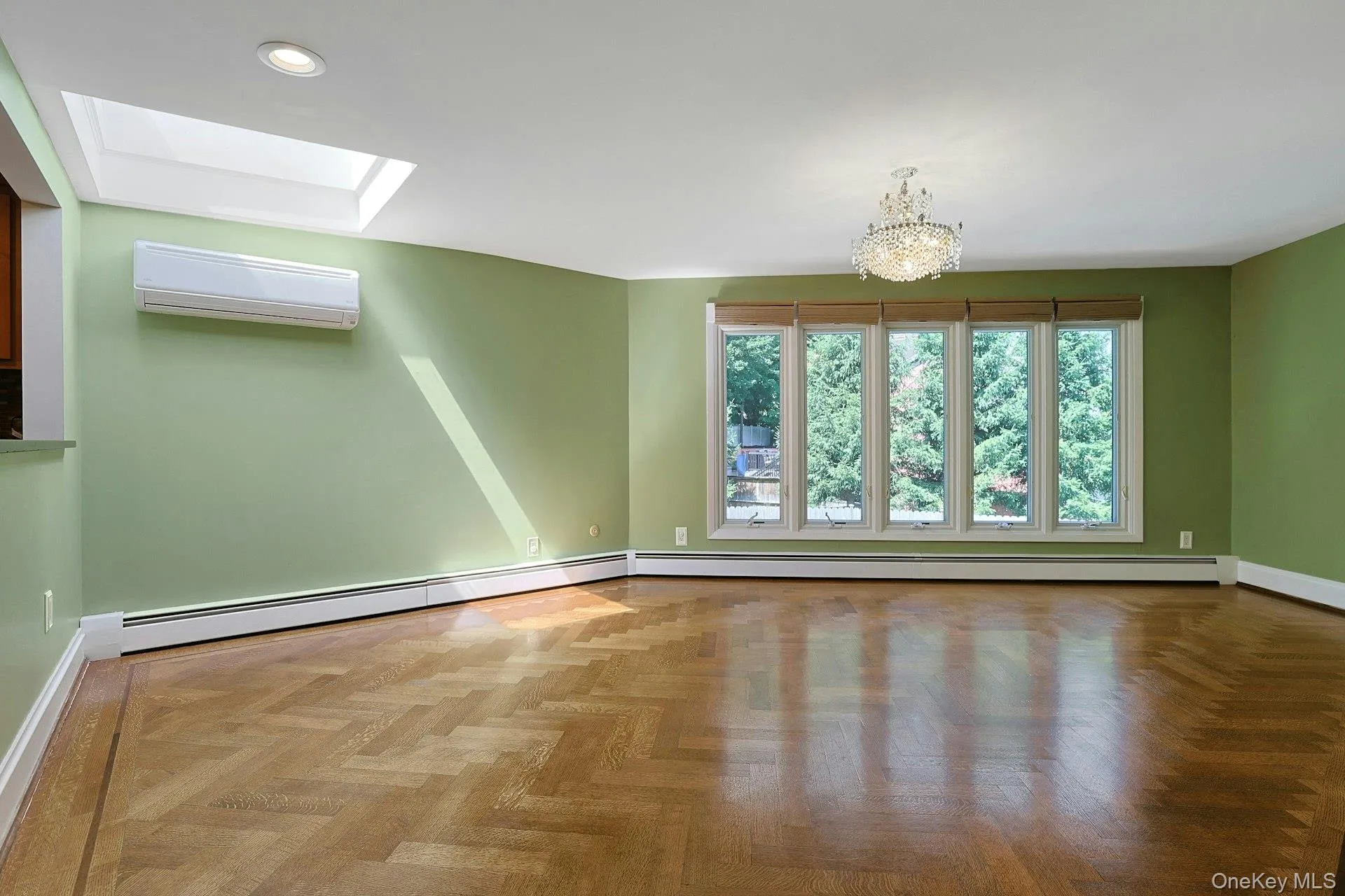 The spacious dining room is graced by a large skylight and wall of windows overlooking the private pool. The spacious dining room is graced by a large skylight and wall of windows overlooking the private pool.