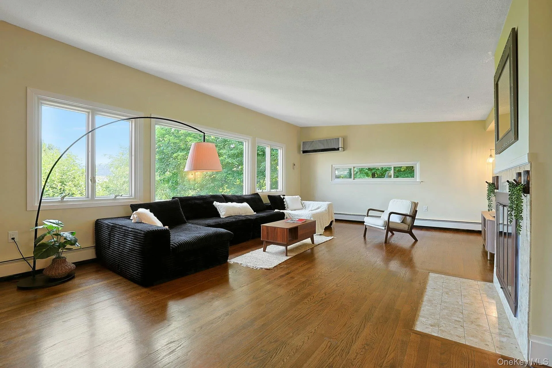 Both deep and wide, the living room has space for so much seating, and countless design opportunities. The wood floors glow under the natural light. Both deep and wide, the living room has space for so much seating, and countless design opportunities. The wood floors glow under the natural light.