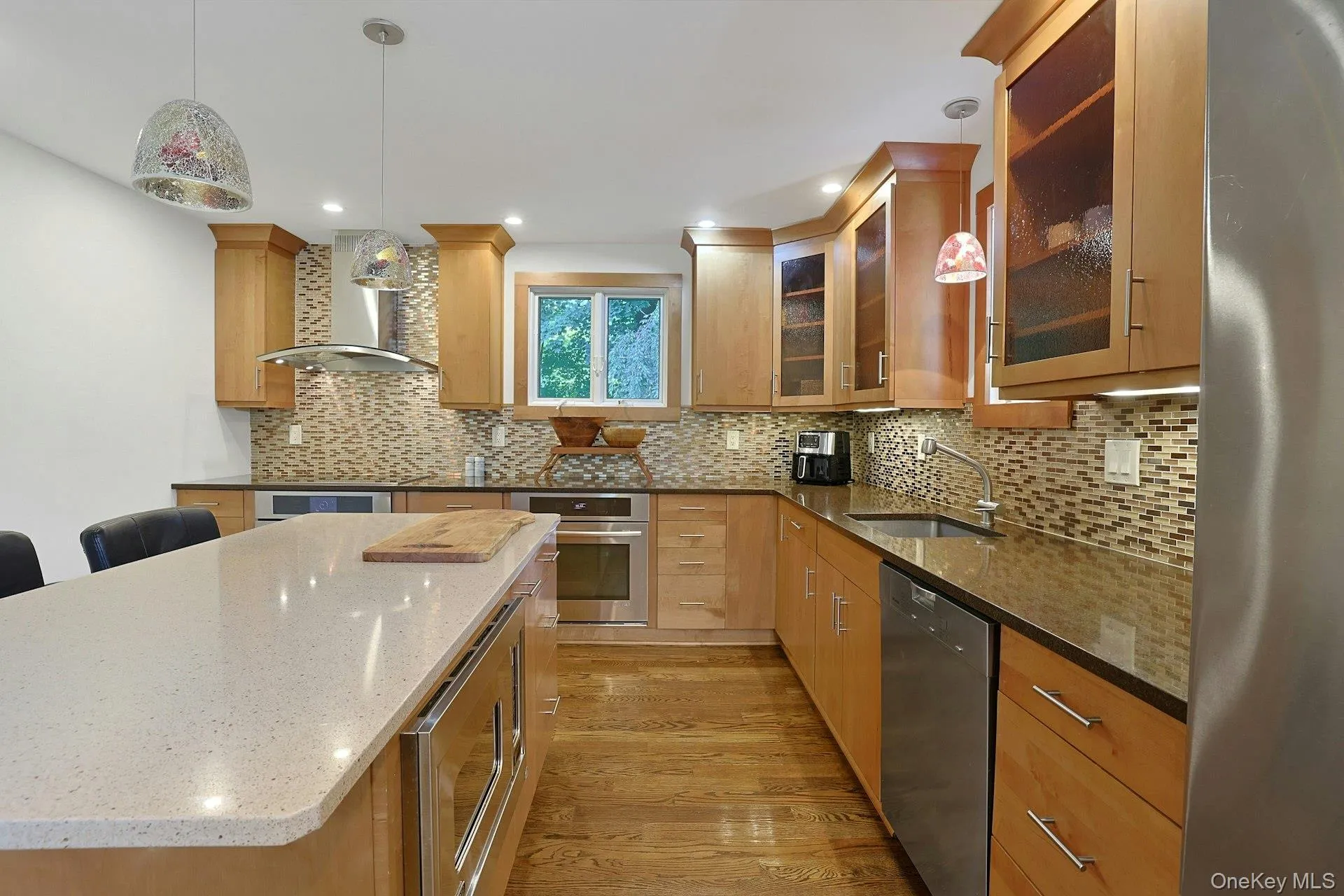 Two Jenn-Air ovens, a Miele induction stove top, Viking microwave and beautiful tile backsplash make working here easy, and fun. Two Jenn-Air ovens, a Miele induction stove top, Viking microwave and beautiful tile backsplash make working here easy, and fun.