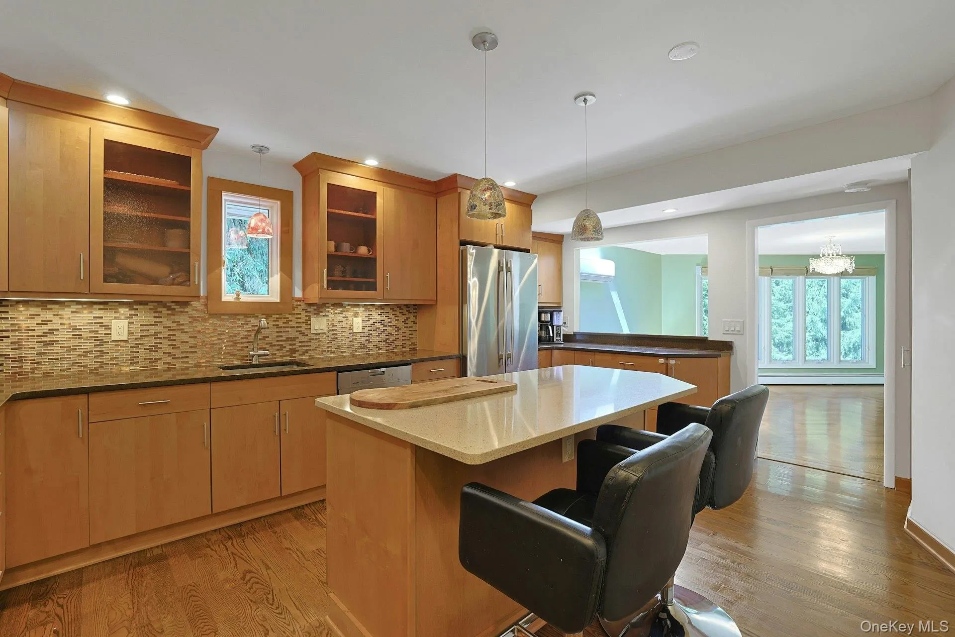 The eat-in island, spacious granite counters and abundant cabinet space should be seen in person to be truly appreciated. The kitchen opens to the dining room, for easy flow. The eat-in island, spacious granite counters and abundant cabinet space should be seen in person to be truly appreciated. The kitchen opens to the dining room, for easy flow.