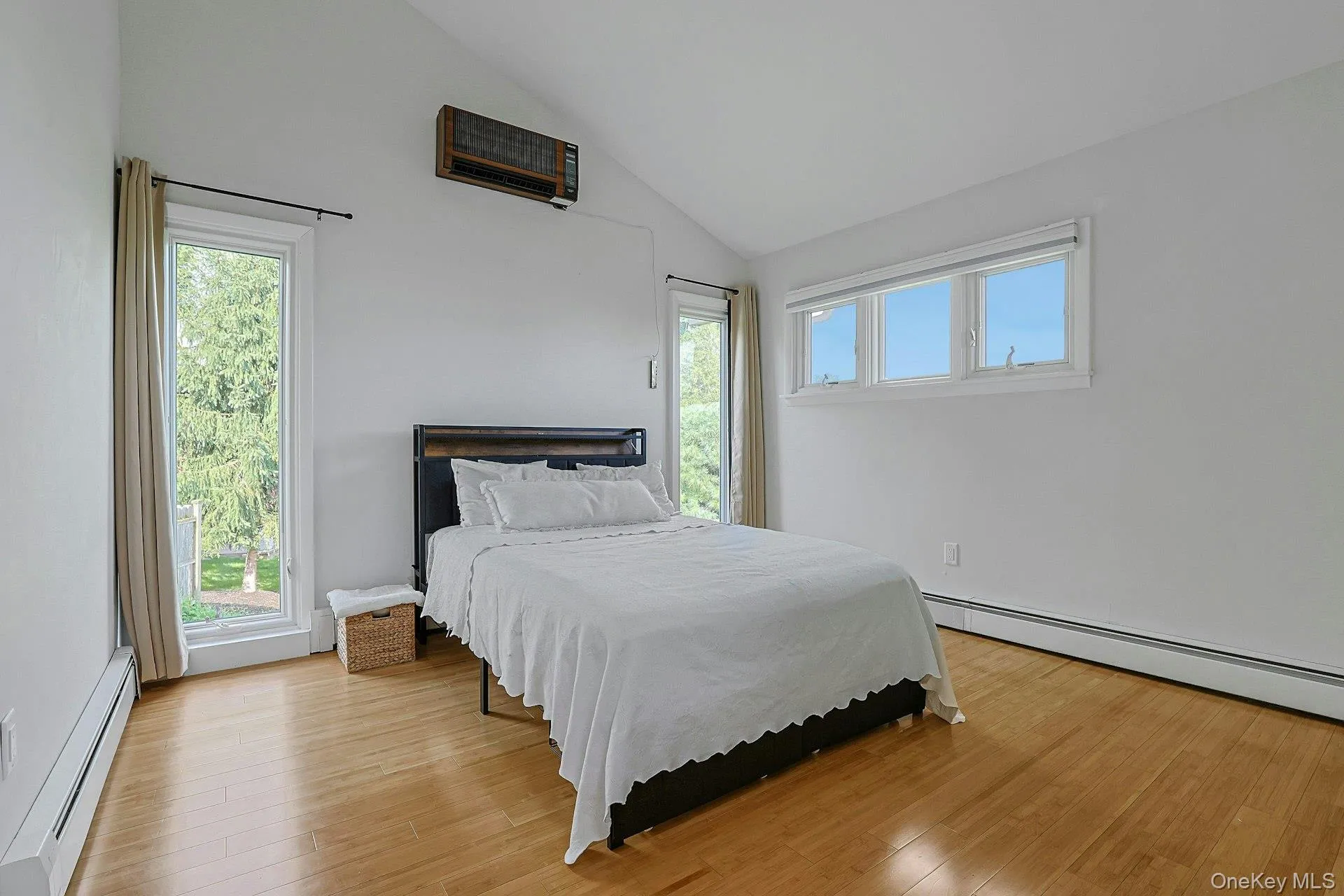 The largest of the other three bedrooms, this corner room with nearly floor to ceiling windows has a deep closet. Vaulted ceilings in this space soar over head. The largest of the other three bedrooms, this corner room with nearly floor to ceiling windows has a deep closet. Vaulted ceilings in this space soar over head.