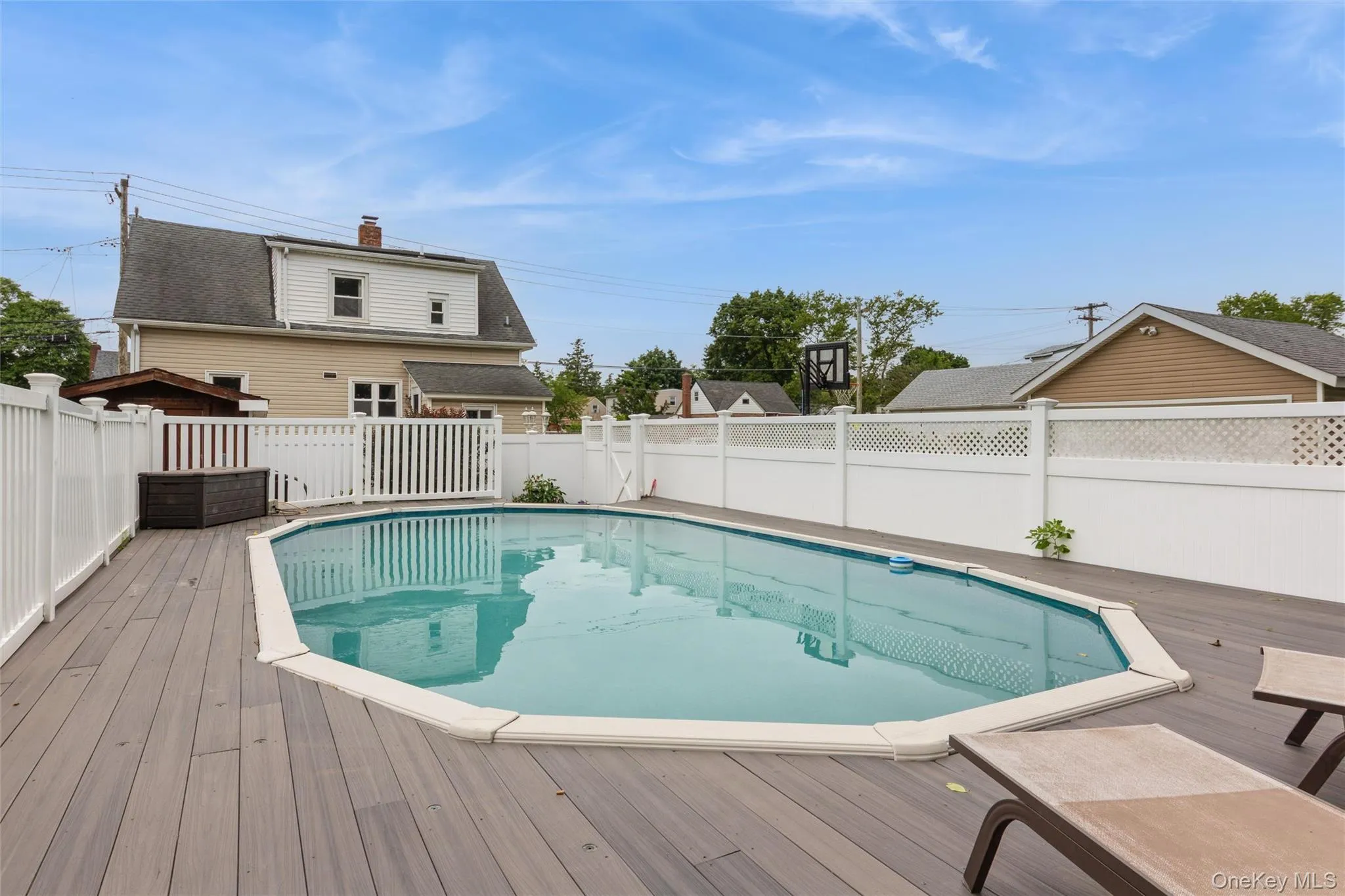swimming pool surrounded by a composite deck swimming pool surrounded by a composite deck