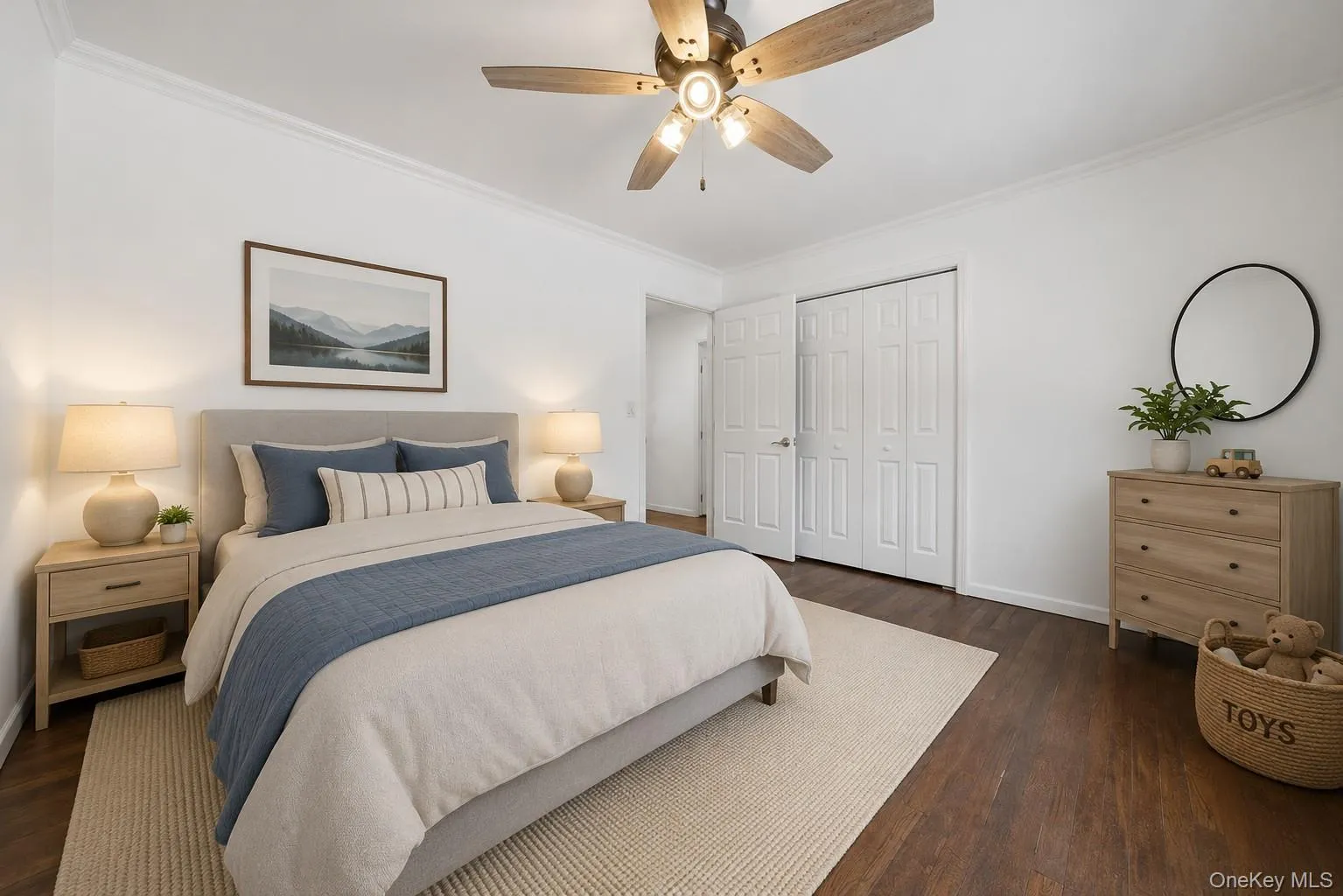 Room featuring wood-finish flooring, white walls, and crown molding Room featuring wood-finish flooring, white walls, and crown molding