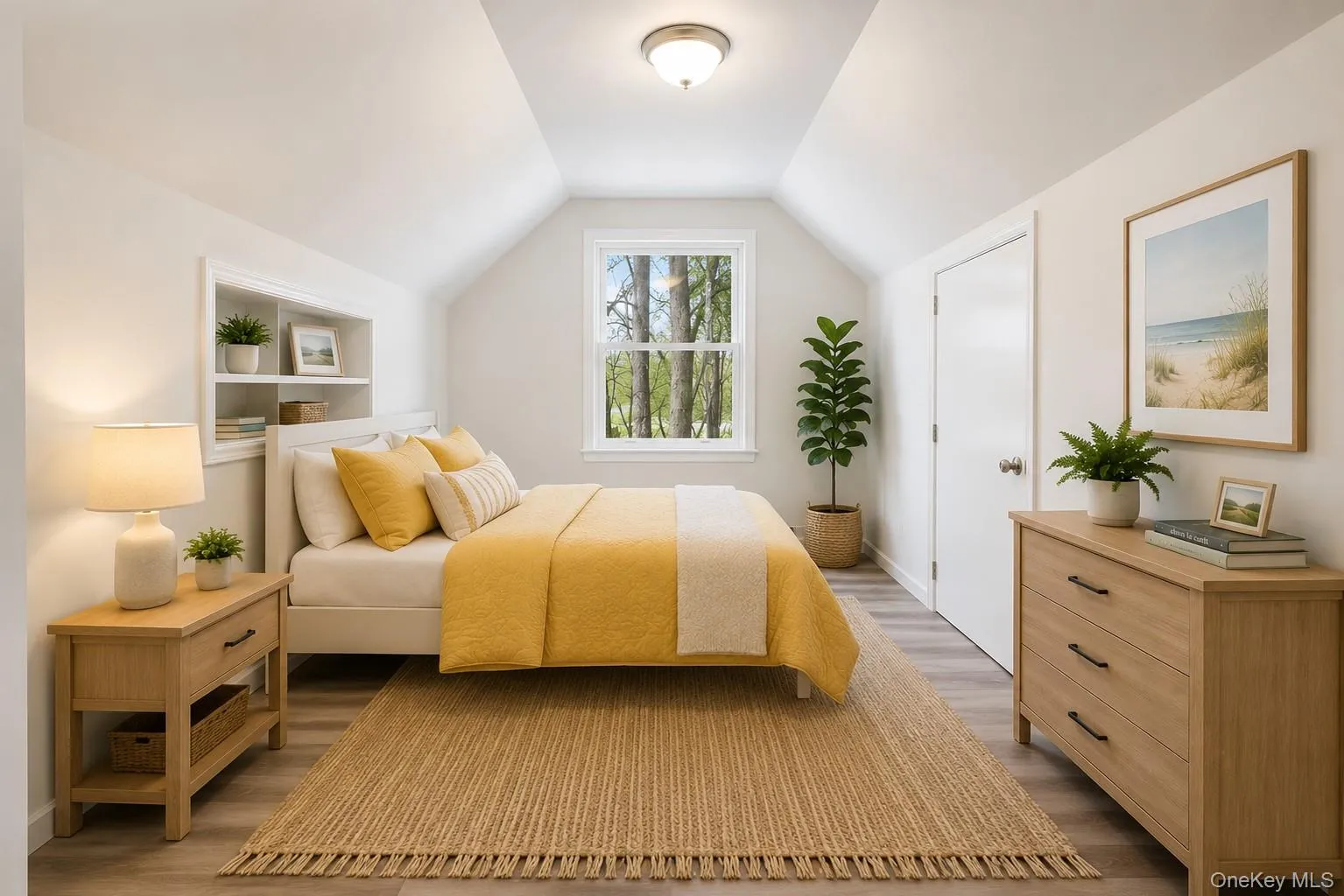 Bedroom featuring a window with exterior tree views, built-in recessed shelving, vaulted ceilings, light wood-finish flooring, and a neutral wall color Bedroom featuring a window with exterior tree views, built-in recessed shelving, vaulted ceilings, light wood-finish flooring, and a neutral wall color
