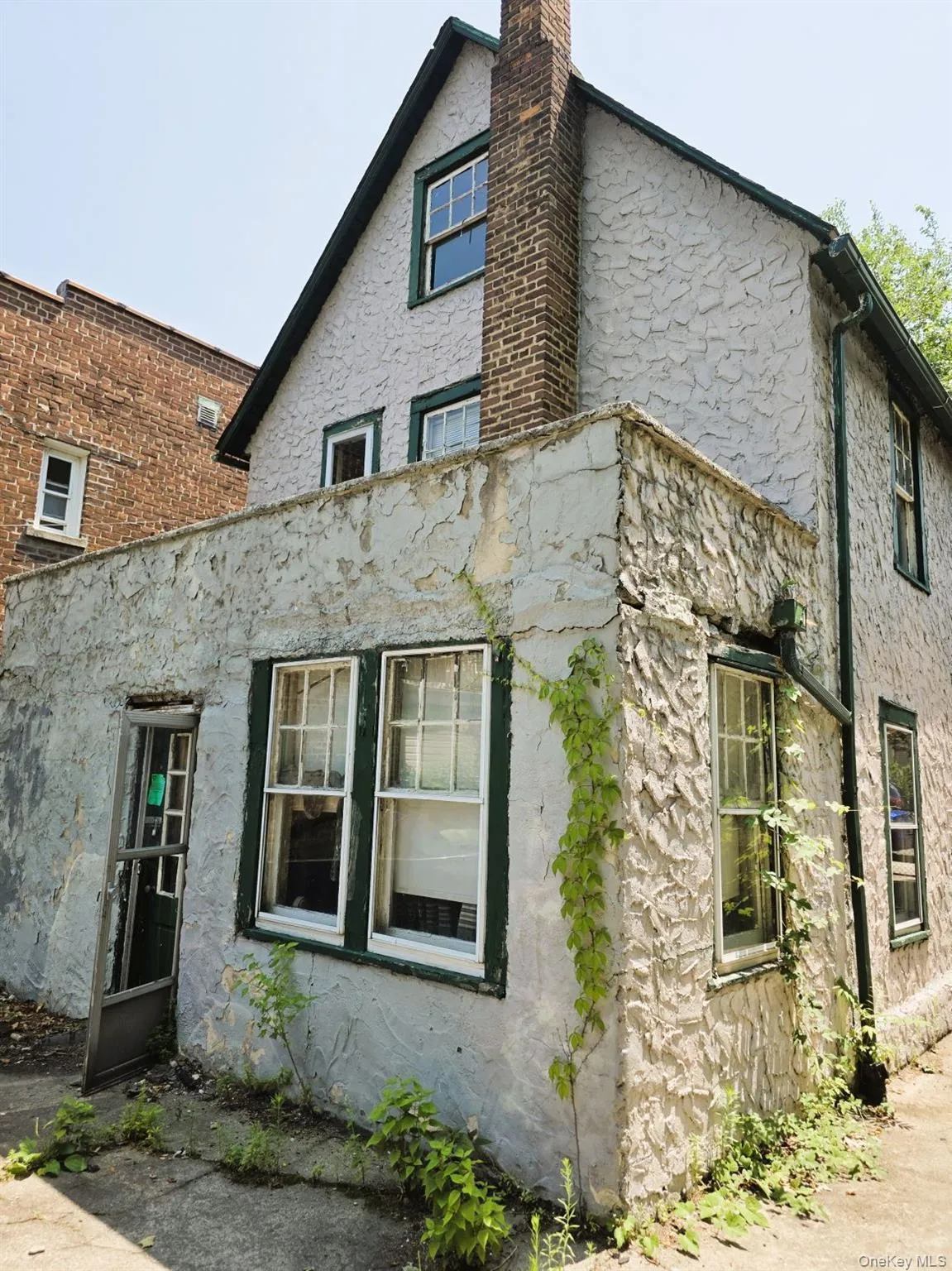 Rear of structure with door access to patio. Rear of structure with door access to patio.