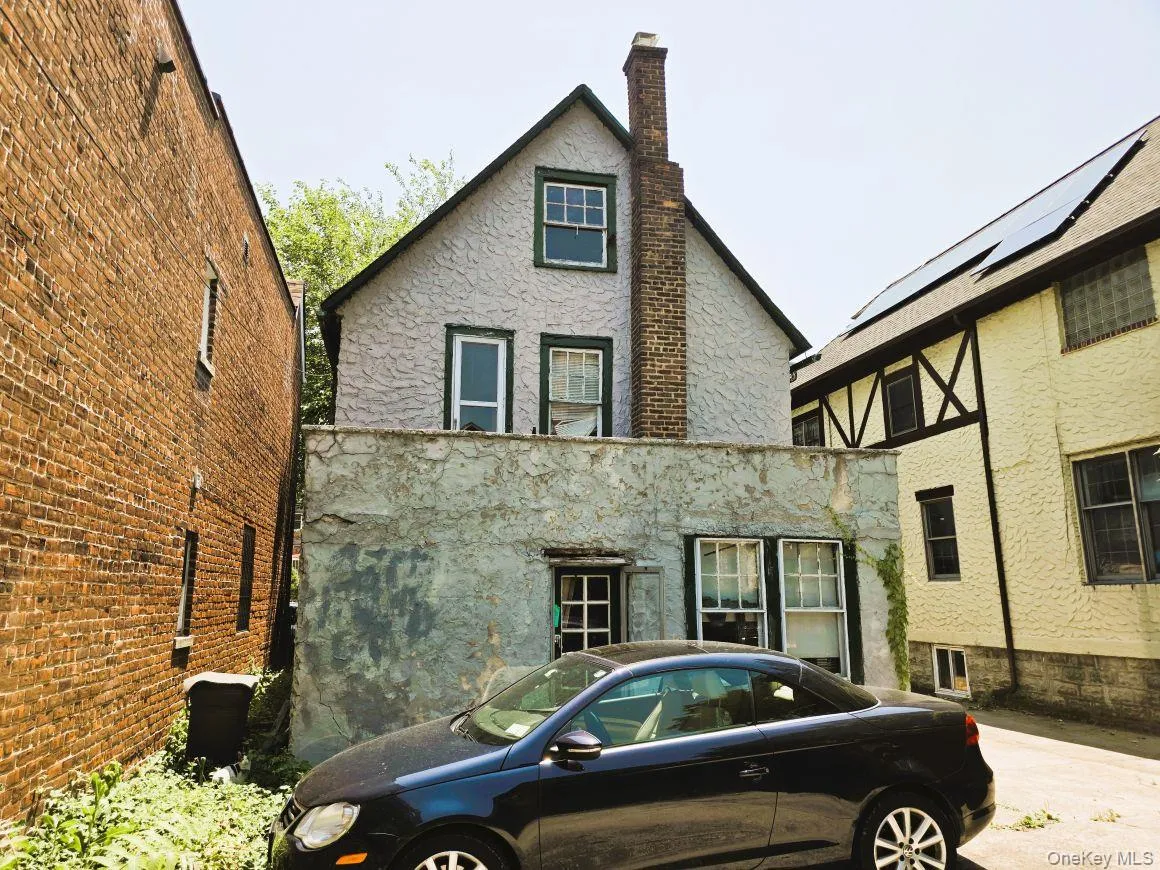 Rear of structure with door access to patio. Rear of structure with door access to patio.