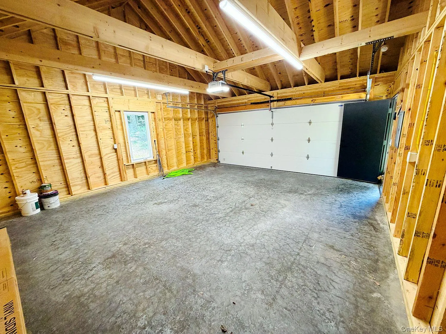 2-car garage, attached via a breezeway to home. Power doors. 2-car garage, attached via a breezeway to home. Power doors.
