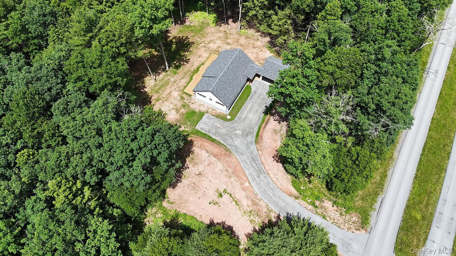 House from above showing driveway and road House from above showing driveway and road