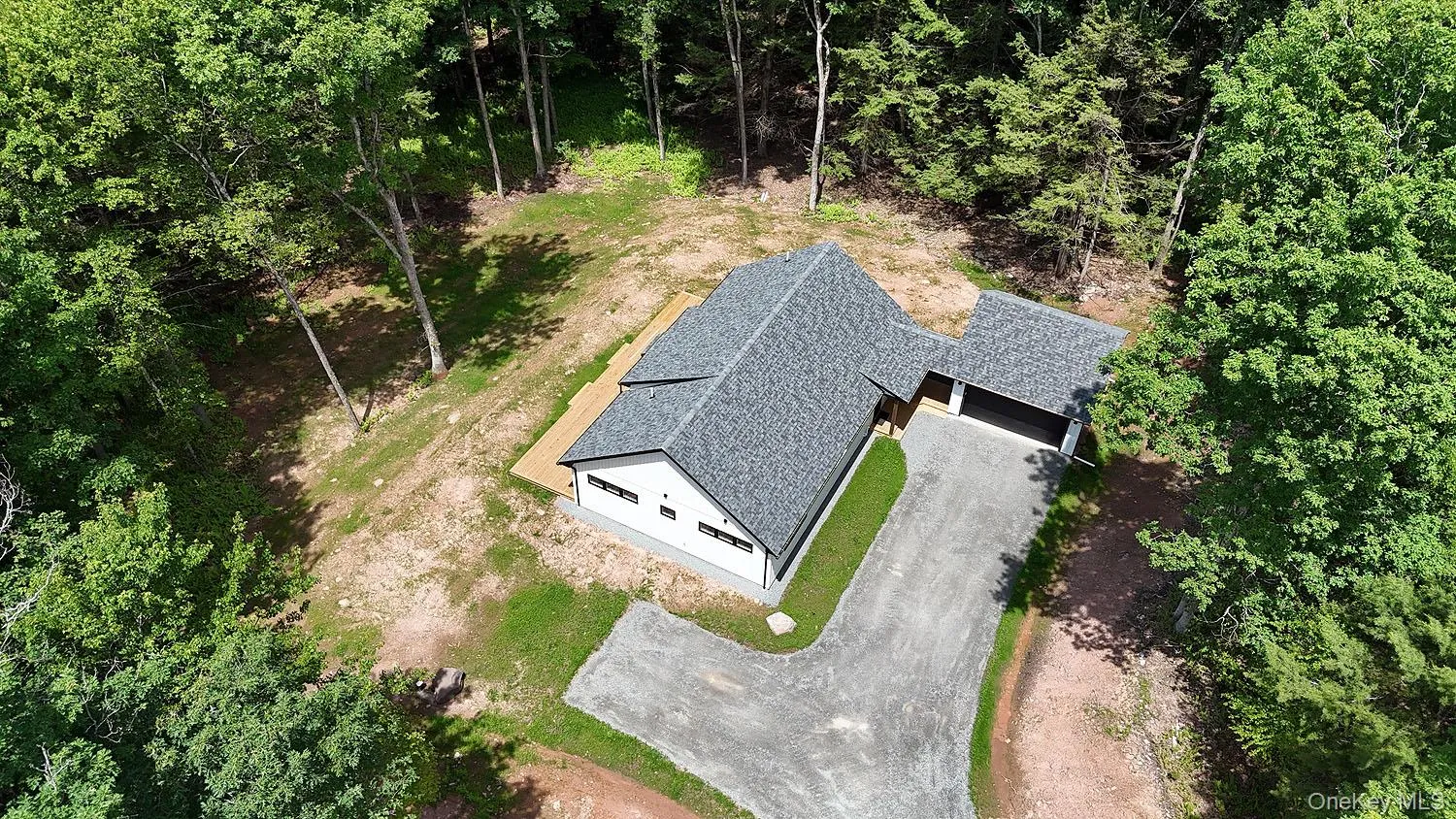 Showing home and garage from above Showing home and garage from above