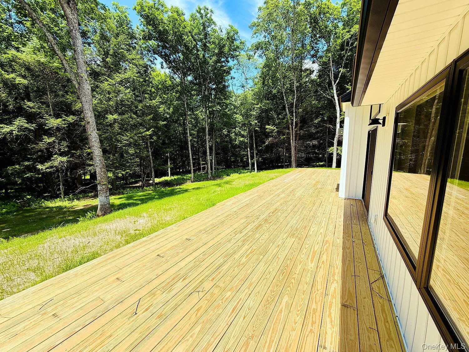 Sliding doors from LR open to this 52 foot long deck, which runs the length of the house. Sliding doors from LR open to this 52 foot long deck, which runs the length of the house.
