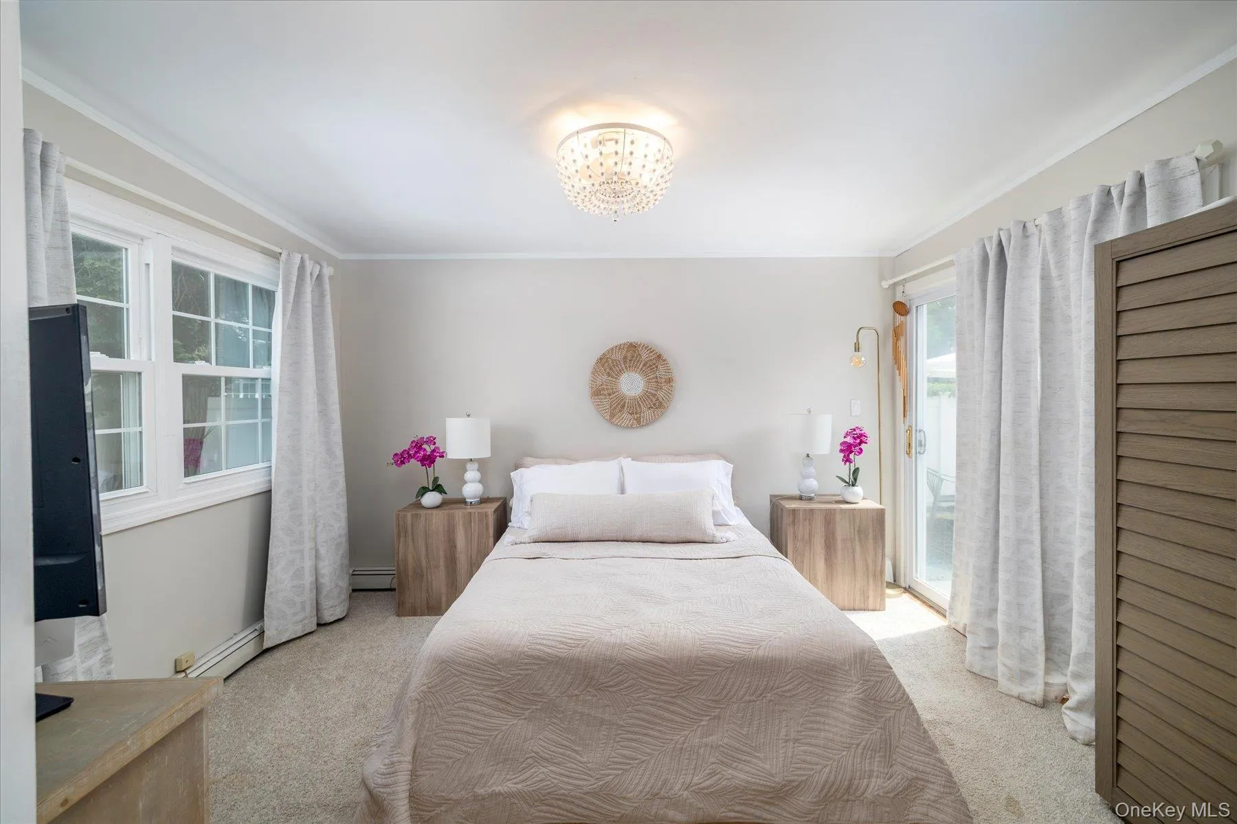 Sunfilled Primary bedroom, sliders overlooking back patio Sunfilled Primary bedroom, sliders overlooking back patio