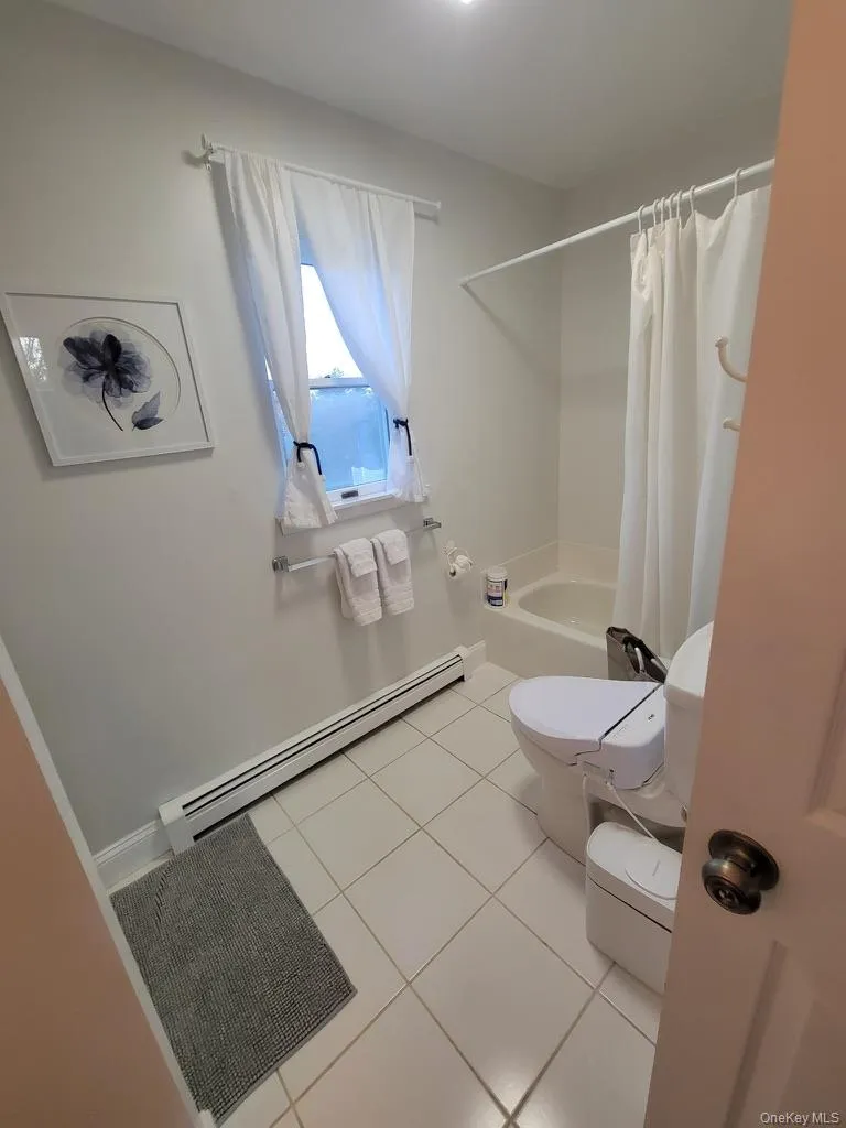 Bathroom with tub and separate shower. Bathroom with tub and separate shower.