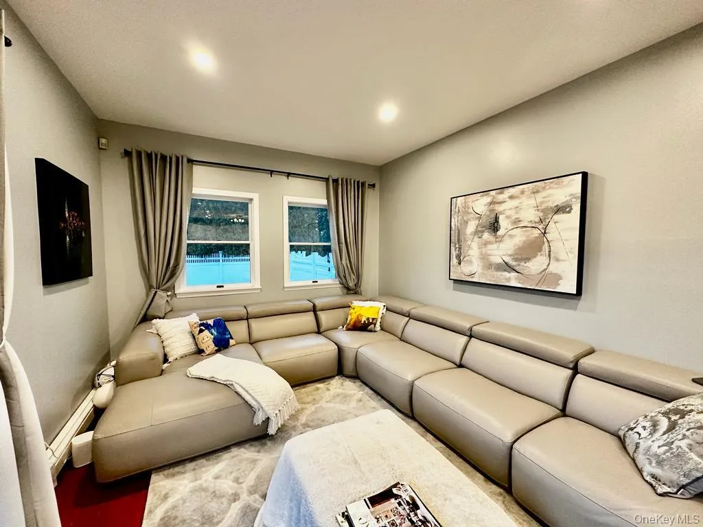 Family room with flat screen TV, opens to outdoor deck Family room with flat screen TV, opens to outdoor deck