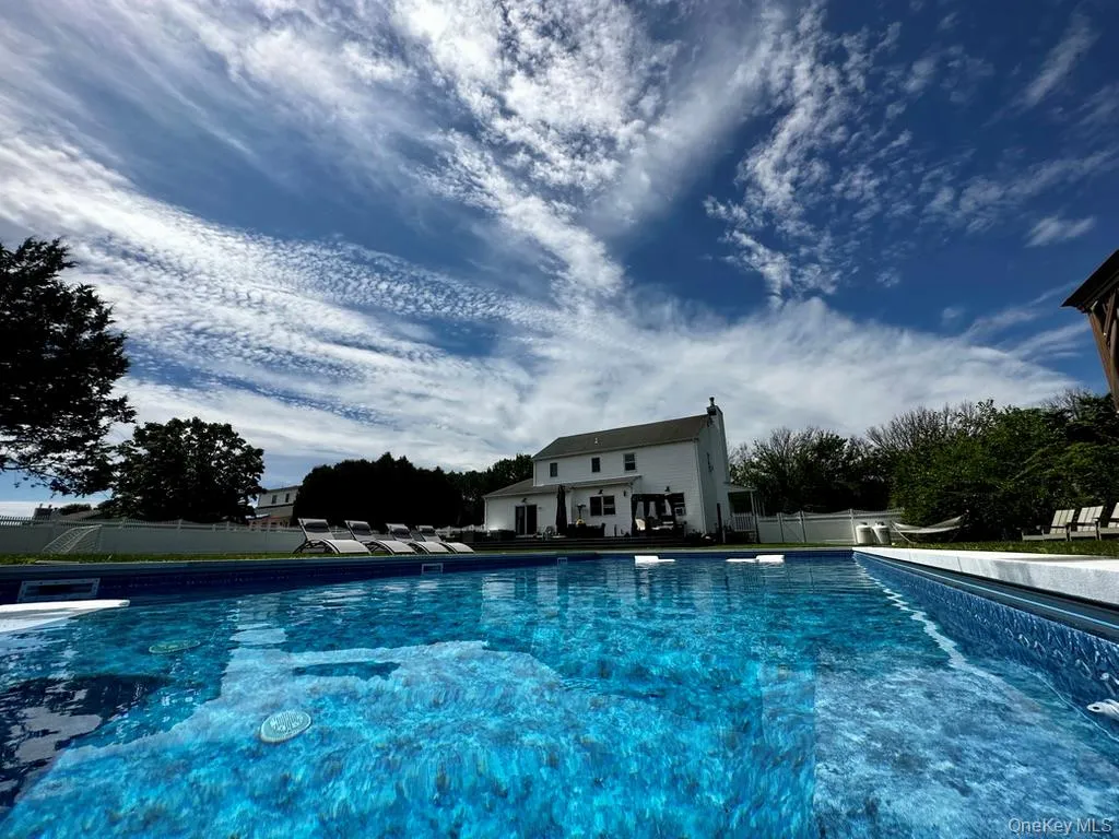 Fenced backyard with in-ground swimming pool. Fenced backyard with in-ground swimming pool.