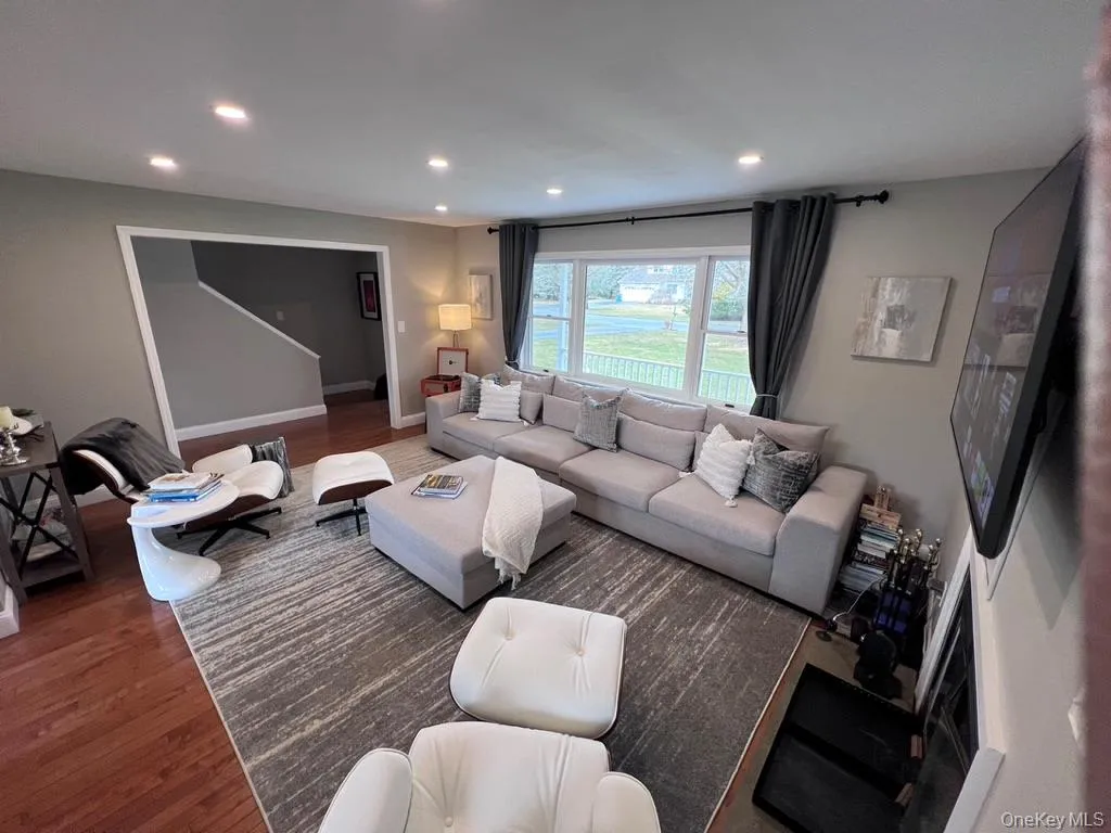Living room view to front door with large window facing proch. Living room view to front door with large window facing proch.