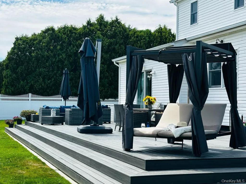 Outdoor deck featuring assigned living areas for lounging, dinners and relaxing. Outdoor deck featuring assigned living areas for lounging, dinners and relaxing.
