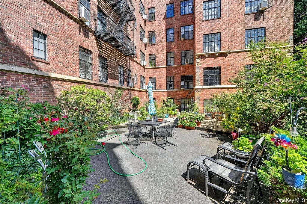 Private residents' back courtyard with seating Private residents' back courtyard with seating