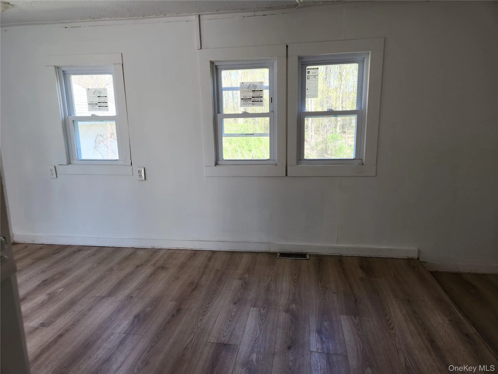 Eat in area where table could easily fit and laminate wood finished floors Eat in area where table could easily fit and laminate wood finished floors