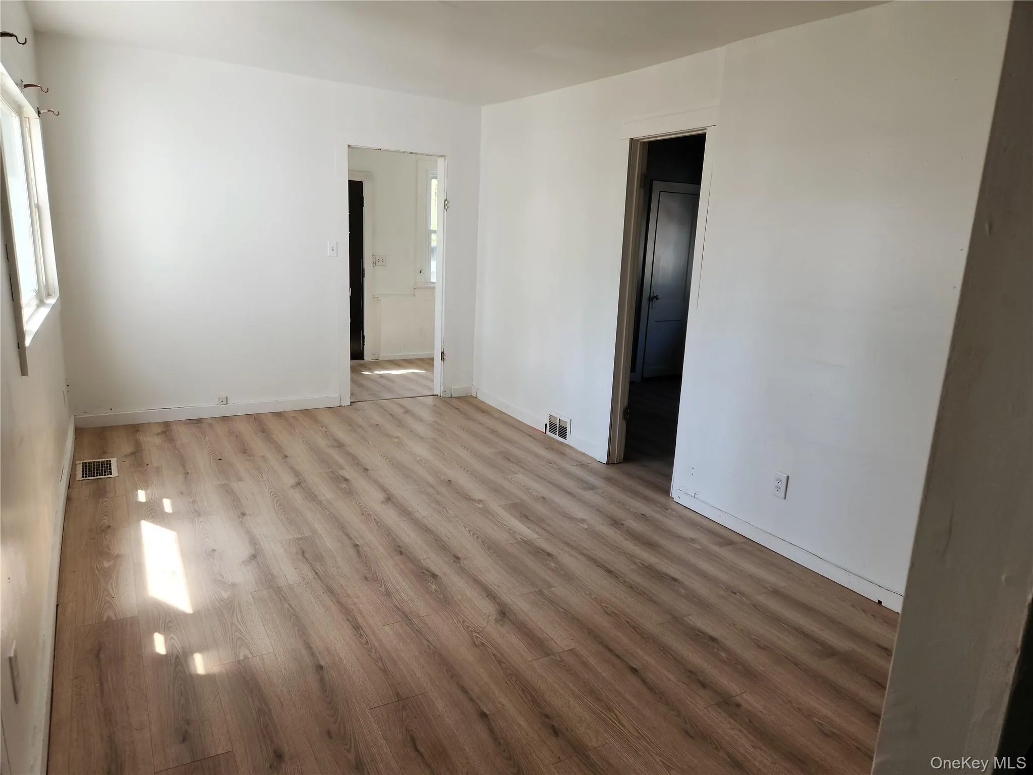 Living room with laminate wood finished floors Living room with laminate wood finished floors