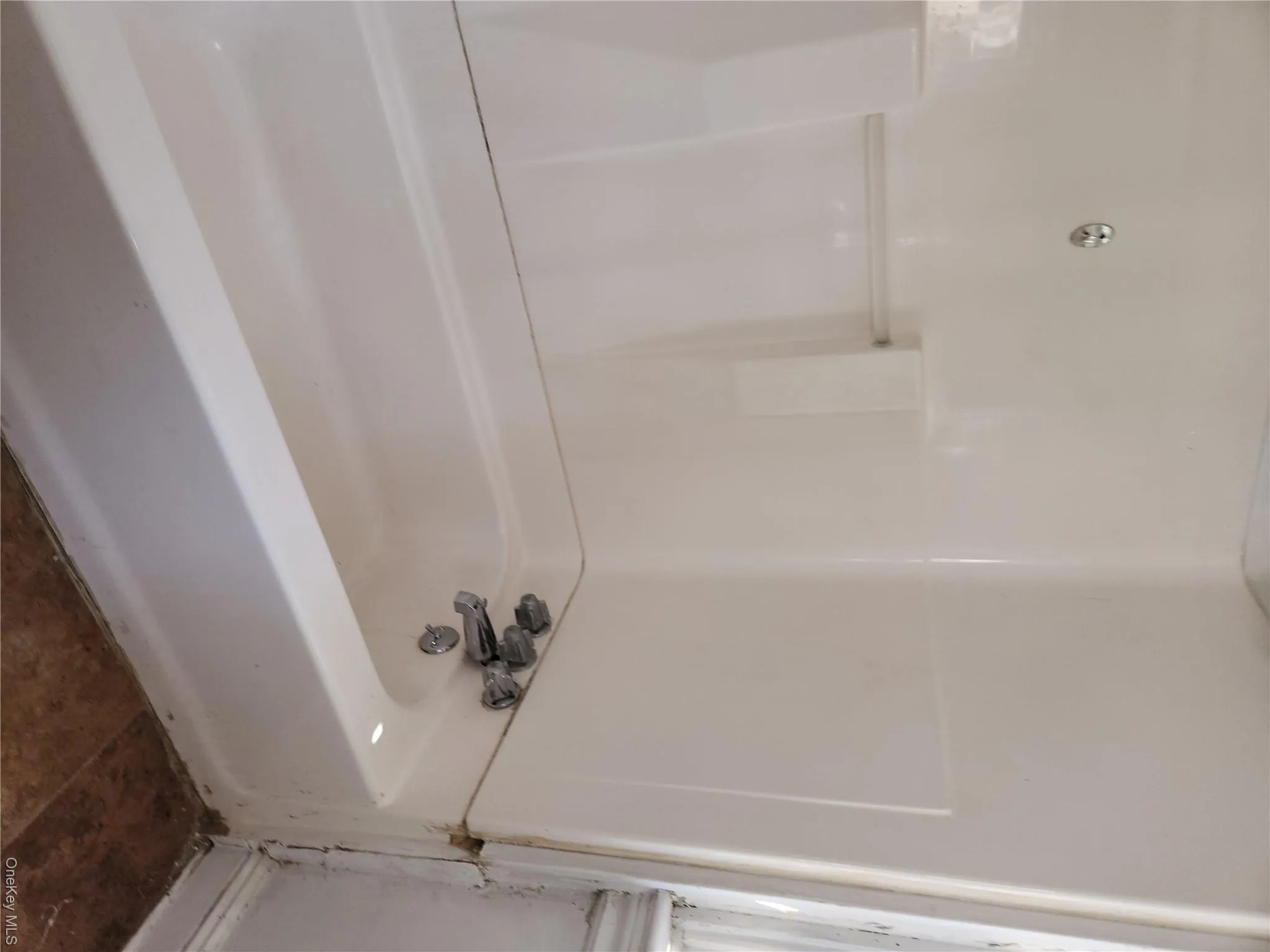 Full bath featuring a tub to relax in Full bath featuring a tub to relax in