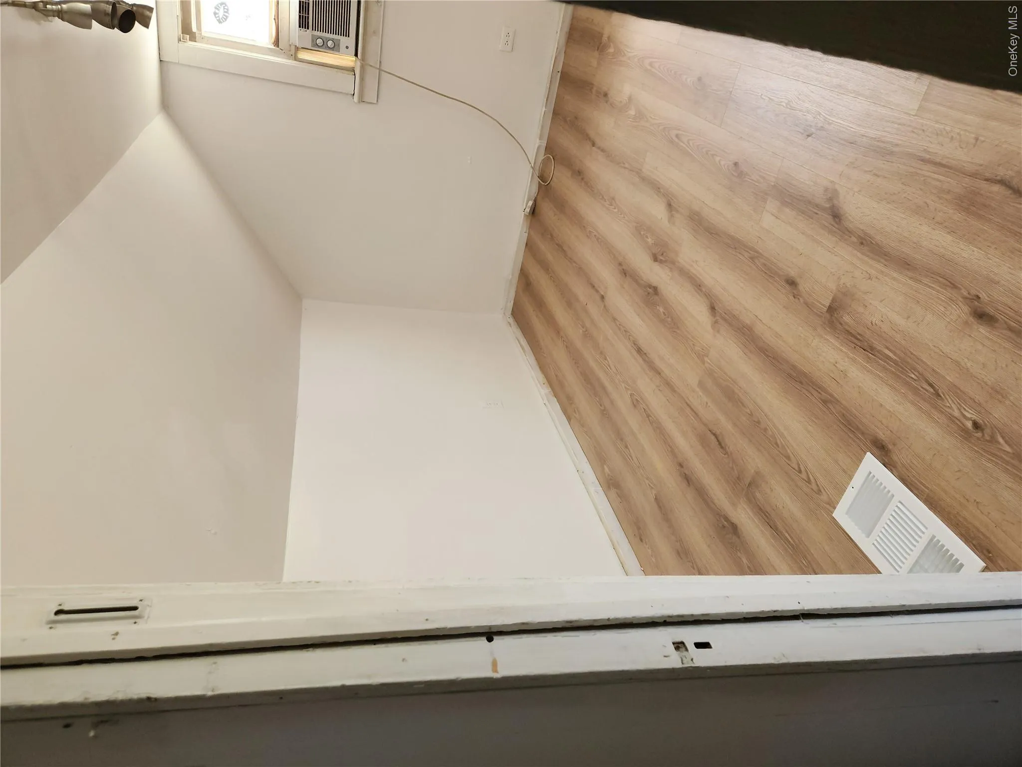 Bonus room with visible vents, light wood finished floors, and lofted ceiling Bonus room with visible vents, light wood finished floors, and lofted ceiling
