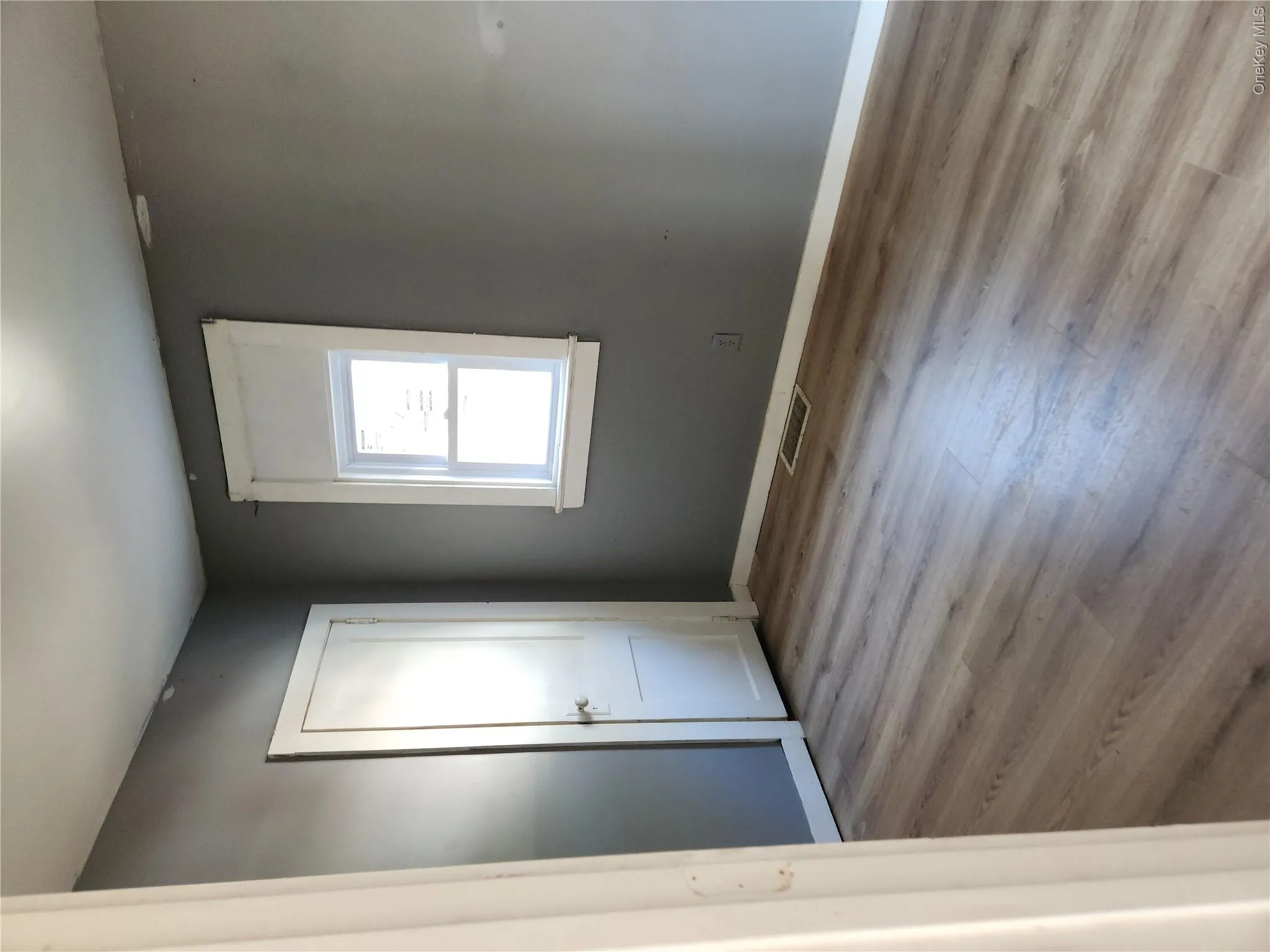 1st Floor bedroom featuring visible vents, and wood finished floors 1st Floor bedroom featuring visible vents, and wood finished floors