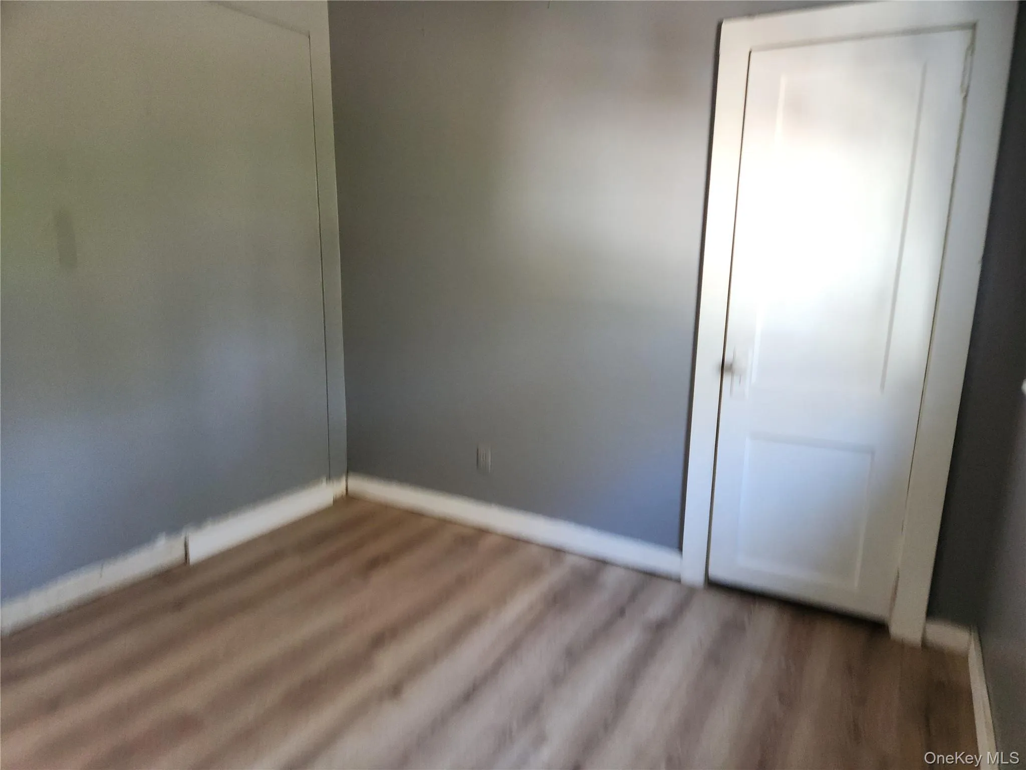 2nd bedroom on 1st floor, with laminate wood finished floors, closet 2nd bedroom on 1st floor, with laminate wood finished floors, closet