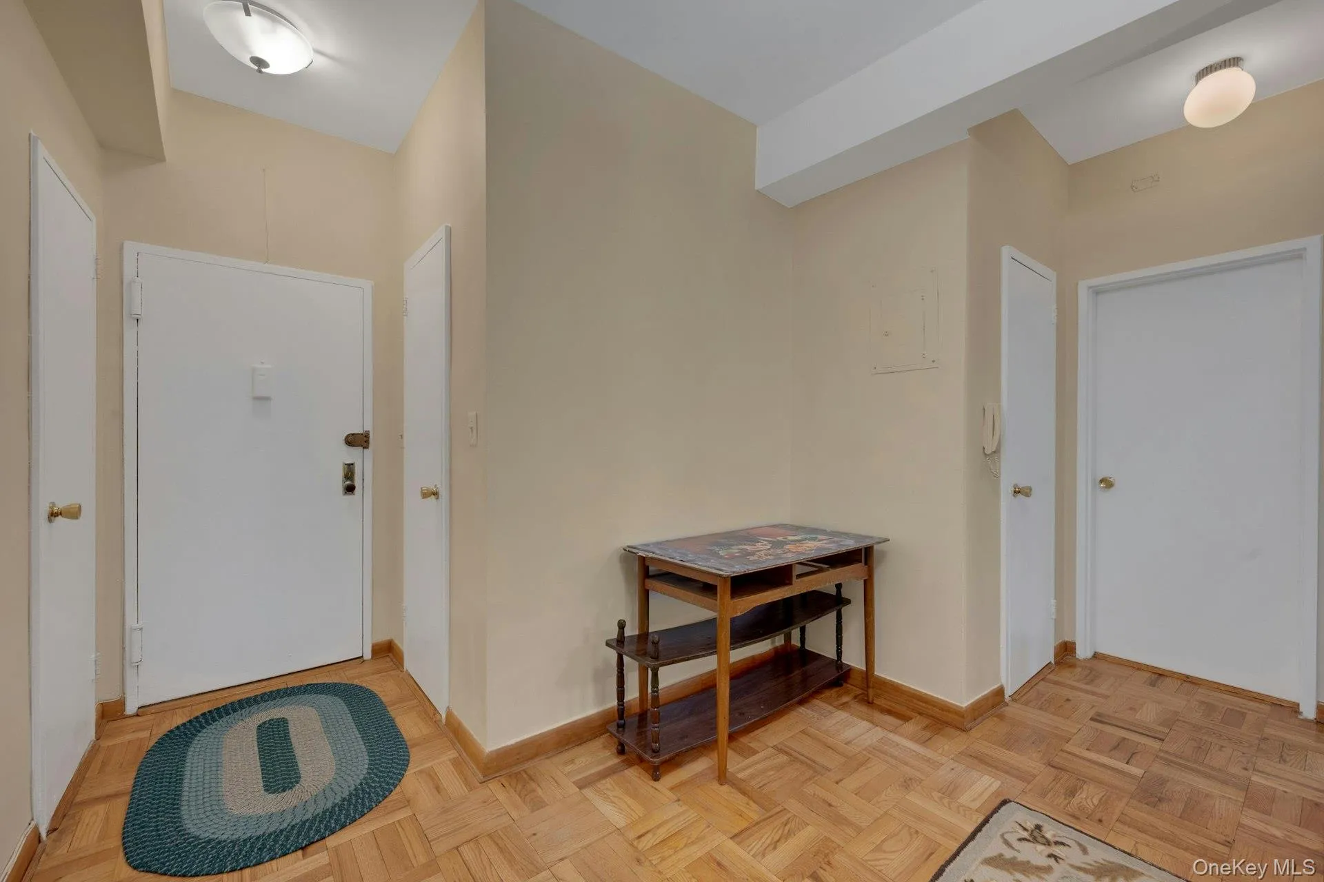 Entry Foyer leading to living room and bedroom. Entry Foyer leading to living room and bedroom.