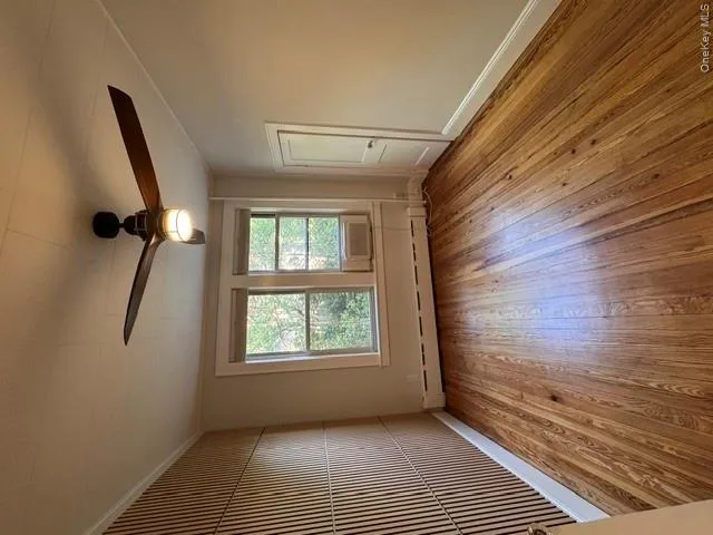 1 of 3 bedrooms with feature wall and ceiling fan 1 of 3 bedrooms with feature wall and ceiling fan