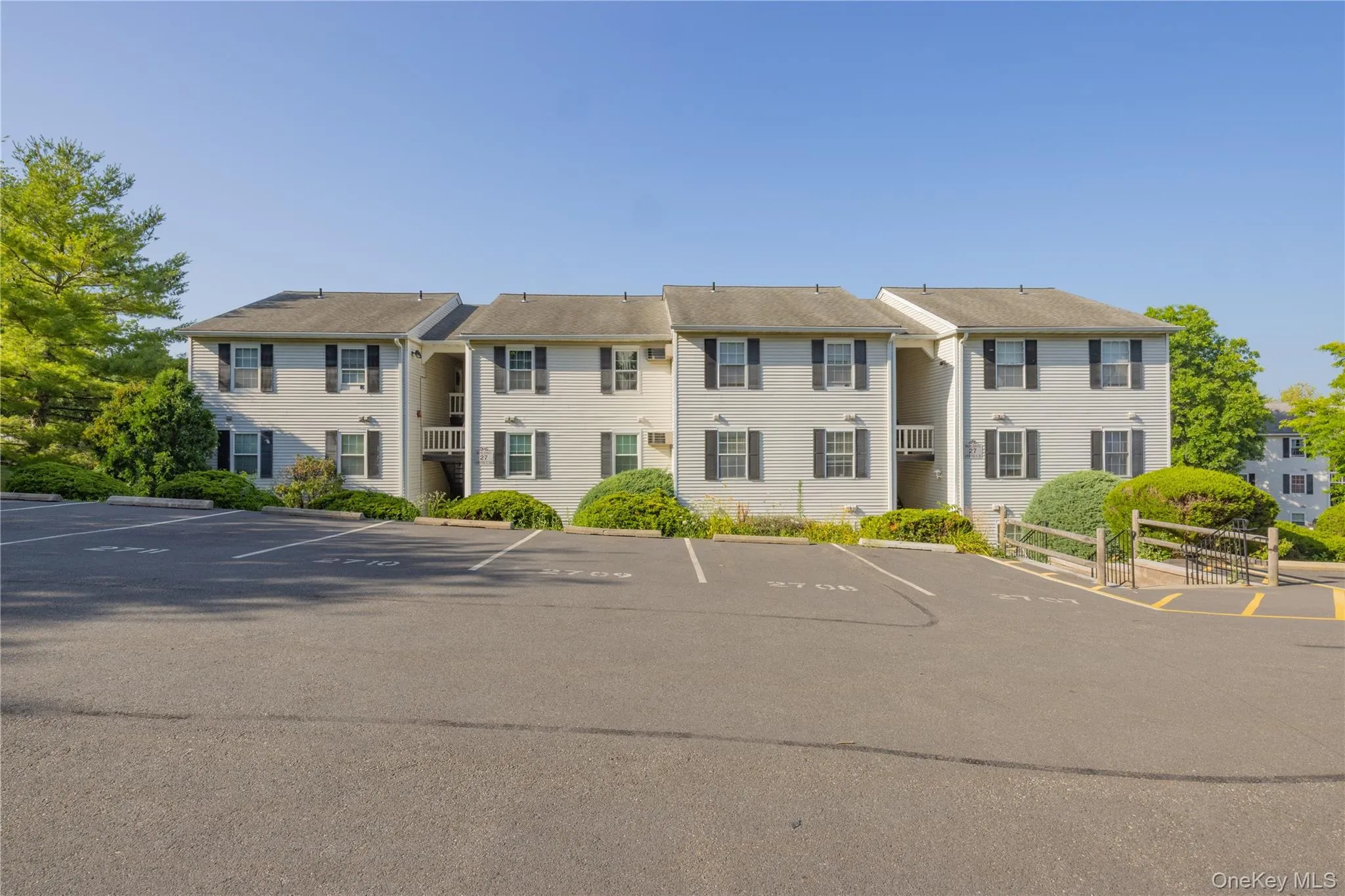 Front of building 27 showing assigned parking spaces Front of building 27 showing assigned parking spaces
