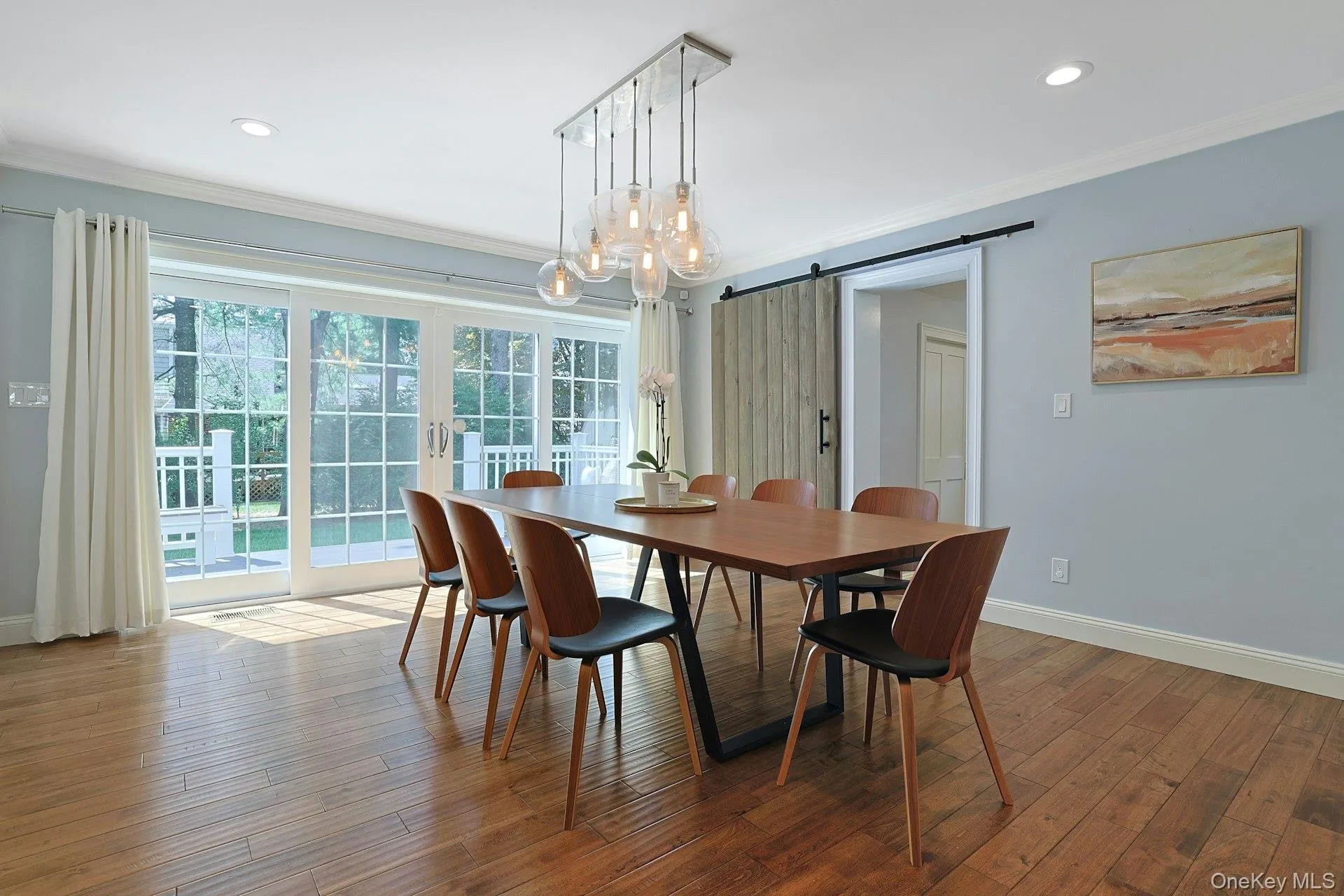 Large dining area with sliding doors to the deck and backyard. Large dining area with sliding doors to the deck and backyard.