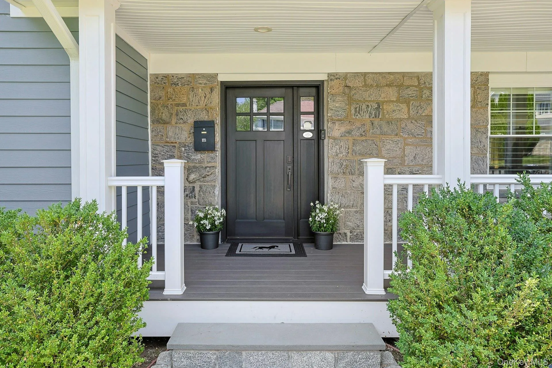 Inviting covered front porch with timeless curb appeal. Inviting covered front porch with timeless curb appeal.