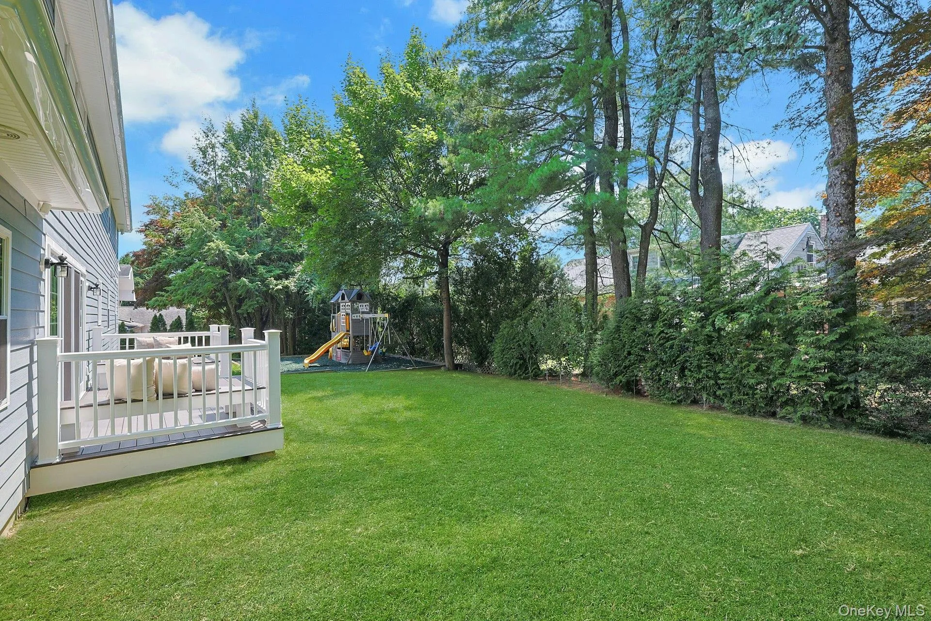 Beautiful, level backyard provides exceptional space for play, entertaining, or simply enjoying the outdoors. Beautiful, level backyard provides exceptional space for play, entertaining, or simply enjoying the outdoors.