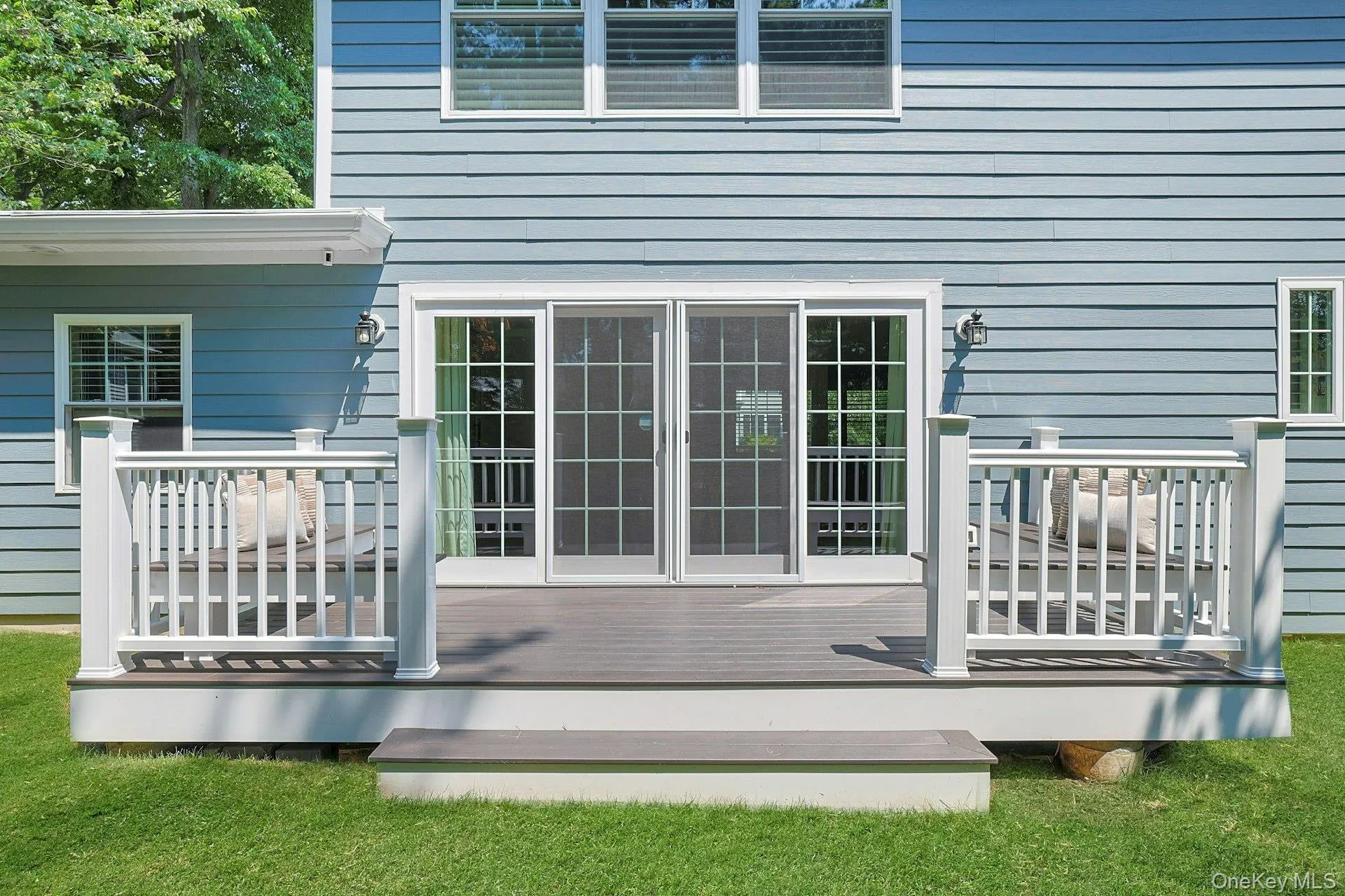 Sliding doors create a seamless connection between the main living spaces and the backyard. Sliding doors create a seamless connection between the main living spaces and the backyard.