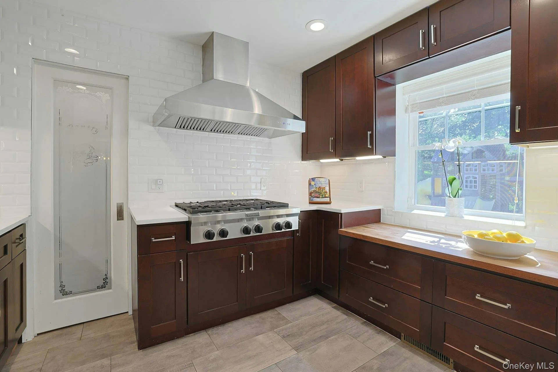 Separate enclosed cooking kitchen keeps meal preparation tucked away. Separate enclosed cooking kitchen keeps meal preparation tucked away.
