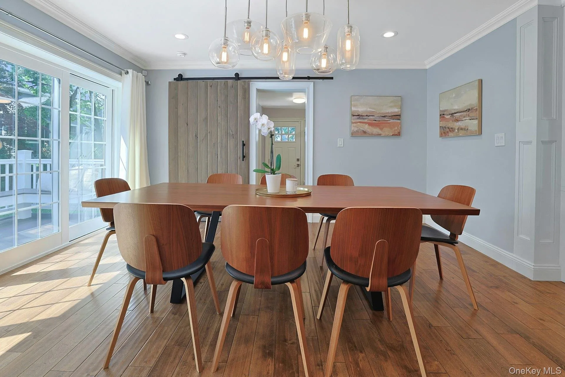 Another view of the dining area, perfectly positioned for everyday meals and celebrations. Mudroom, laundry room and garage access behind the table. Another view of the dining area, perfectly positioned for everyday meals and celebrations. Mudroom, laundry room and garage access behind the table.