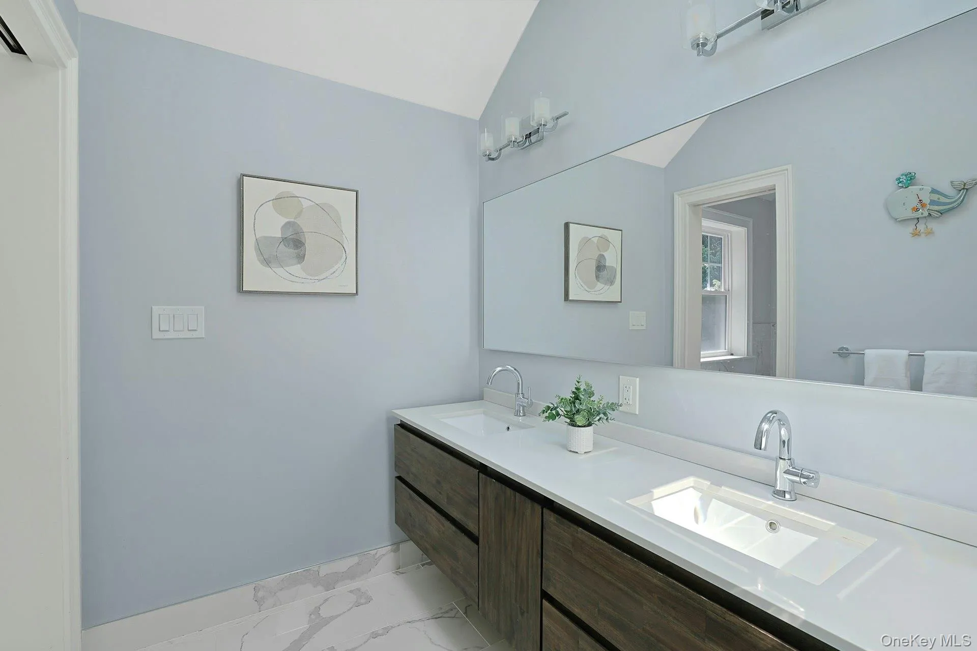 Beautifully renovated hall bath with double vanity, private water closet, and tub/shower combination. Beautifully renovated hall bath with double vanity, private water closet, and tub/shower combination.
