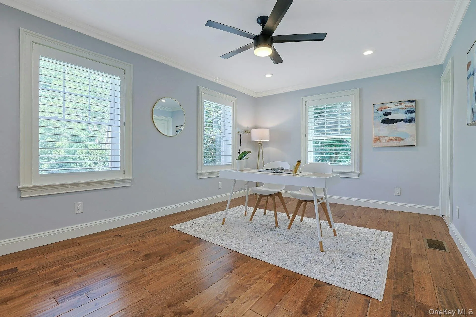 Versatile first-floor bedroom with a walk-in closet and renovated ensuite bath, ideal as a guest suite, in-law suite, or private home office. Versatile first-floor bedroom with a walk-in closet and renovated ensuite bath, ideal as a guest suite, in-law suite, or private home office.