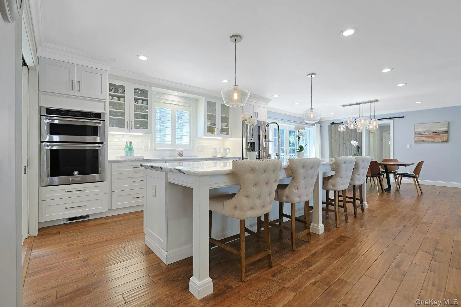 Expansive island anchors this beautifully designed kitchen. Expansive island anchors this beautifully designed kitchen.