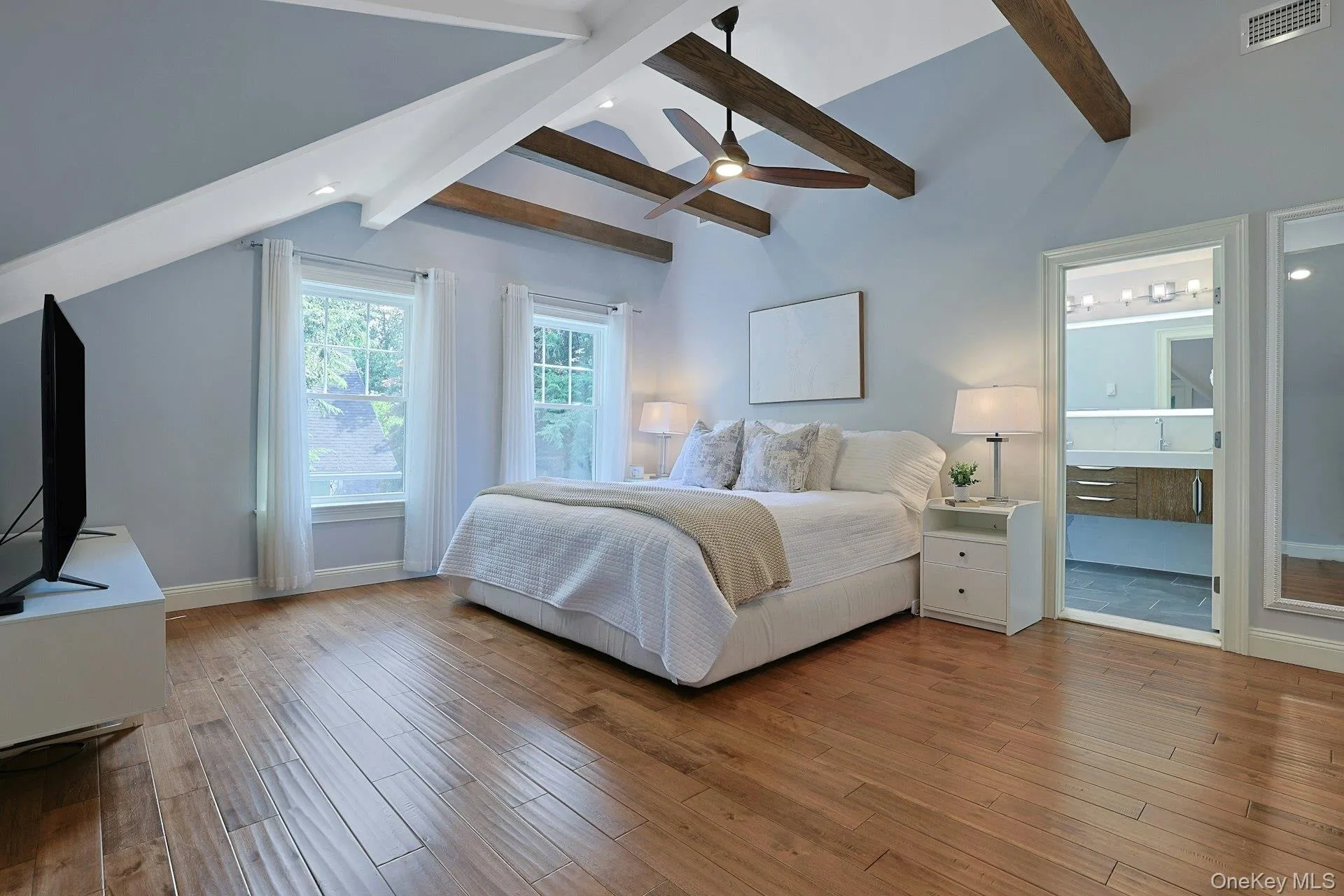 Another view of the serene primary retreat showcasing its impressive scale and spa-like ensuite. Another view of the serene primary retreat showcasing its impressive scale and spa-like ensuite.