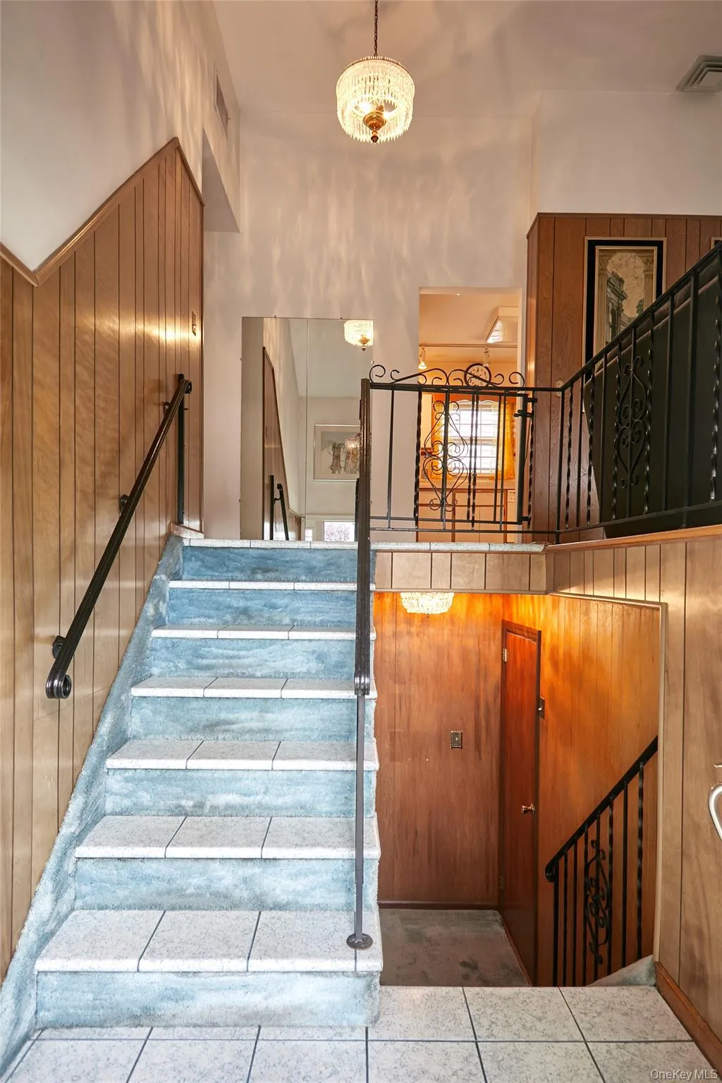 Stairs to the main floor and lower level. Stairs to the main floor and lower level.