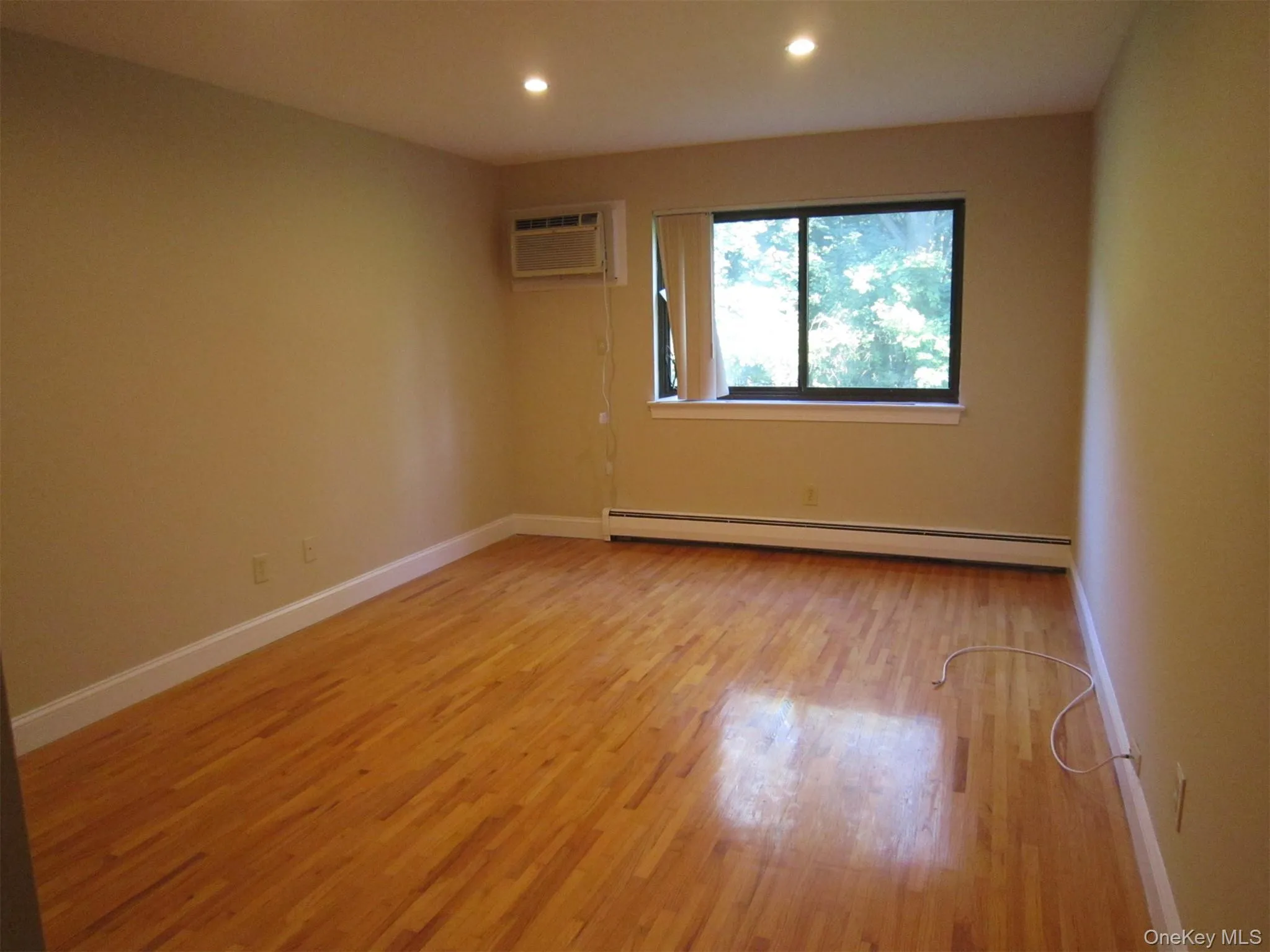 Very spacious primary bedroom suite with beautiful oak floors, recessed lighting and a wall unti air conditioner. Very spacious primary bedroom suite with beautiful oak floors, recessed lighting and a wall unti air conditioner.