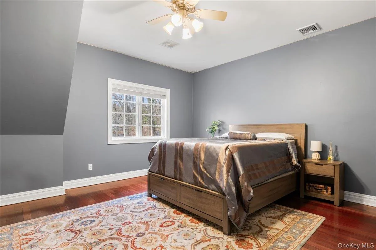 Comfortable fourth upstairs bedroom with handsome baseboards and ample window layouts. Comfortable fourth upstairs bedroom with handsome baseboards and ample window layouts.
