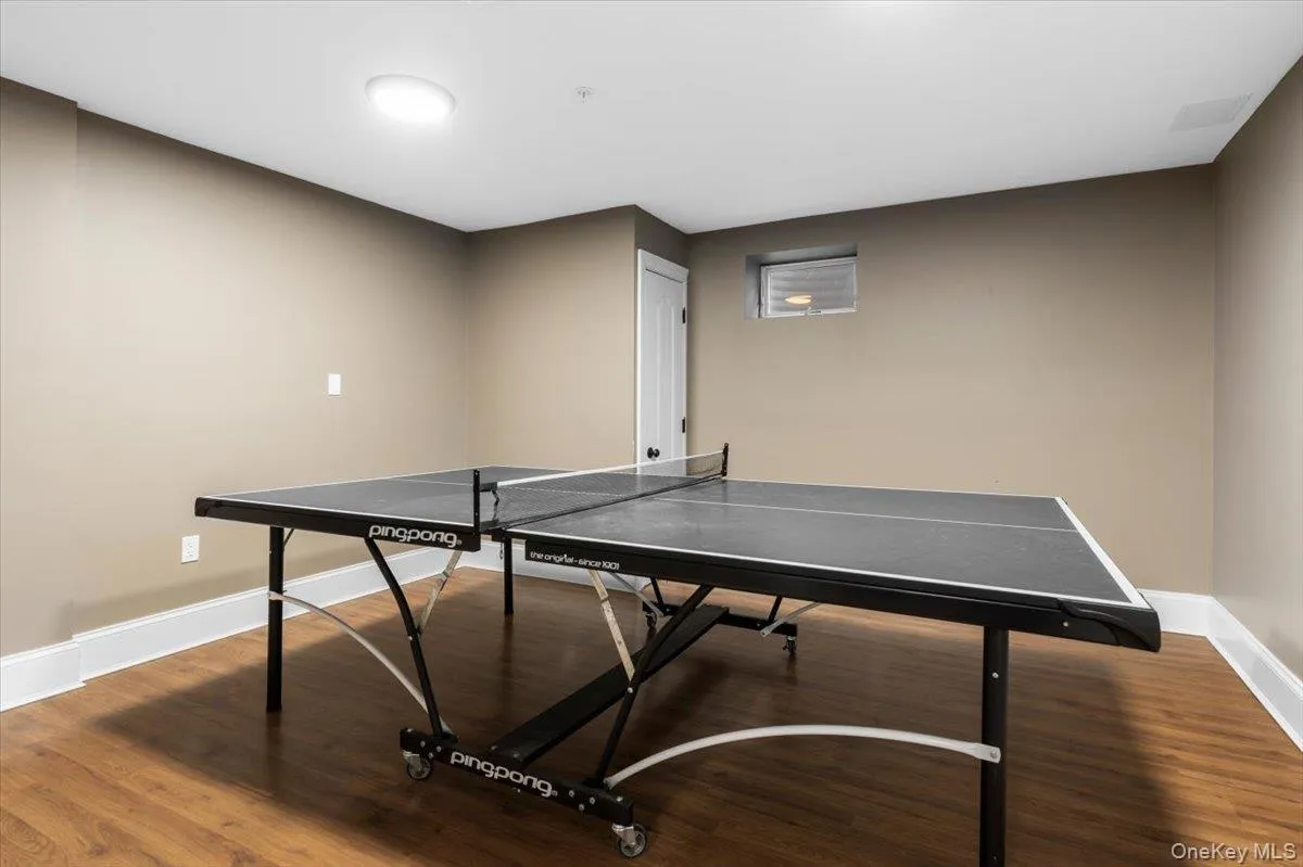 Generous lower-level layout comfortably accommodating a full-sized ping-pong table or home gym. Generous lower-level layout comfortably accommodating a full-sized ping-pong table or home gym.
