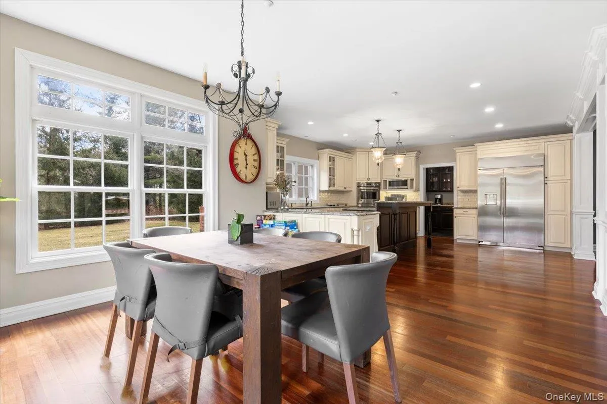 Sweeping open-concept layout connecting the kitchen and everyday dining spaces—ideal for entertaining. Sweeping open-concept layout connecting the kitchen and everyday dining spaces—ideal for entertaining.